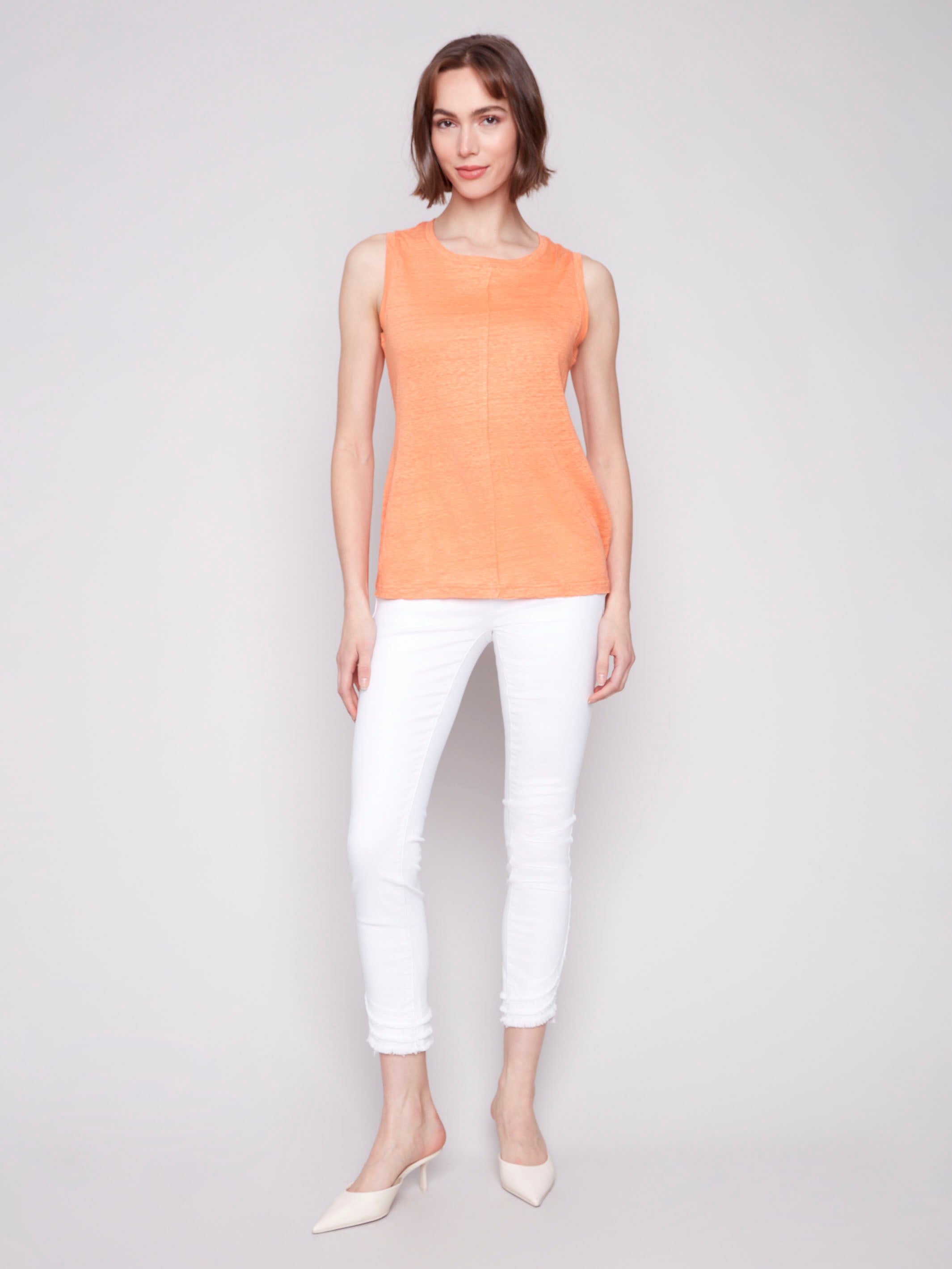 Elegant papaya top featuring a distinctive front seam by Charlie B.