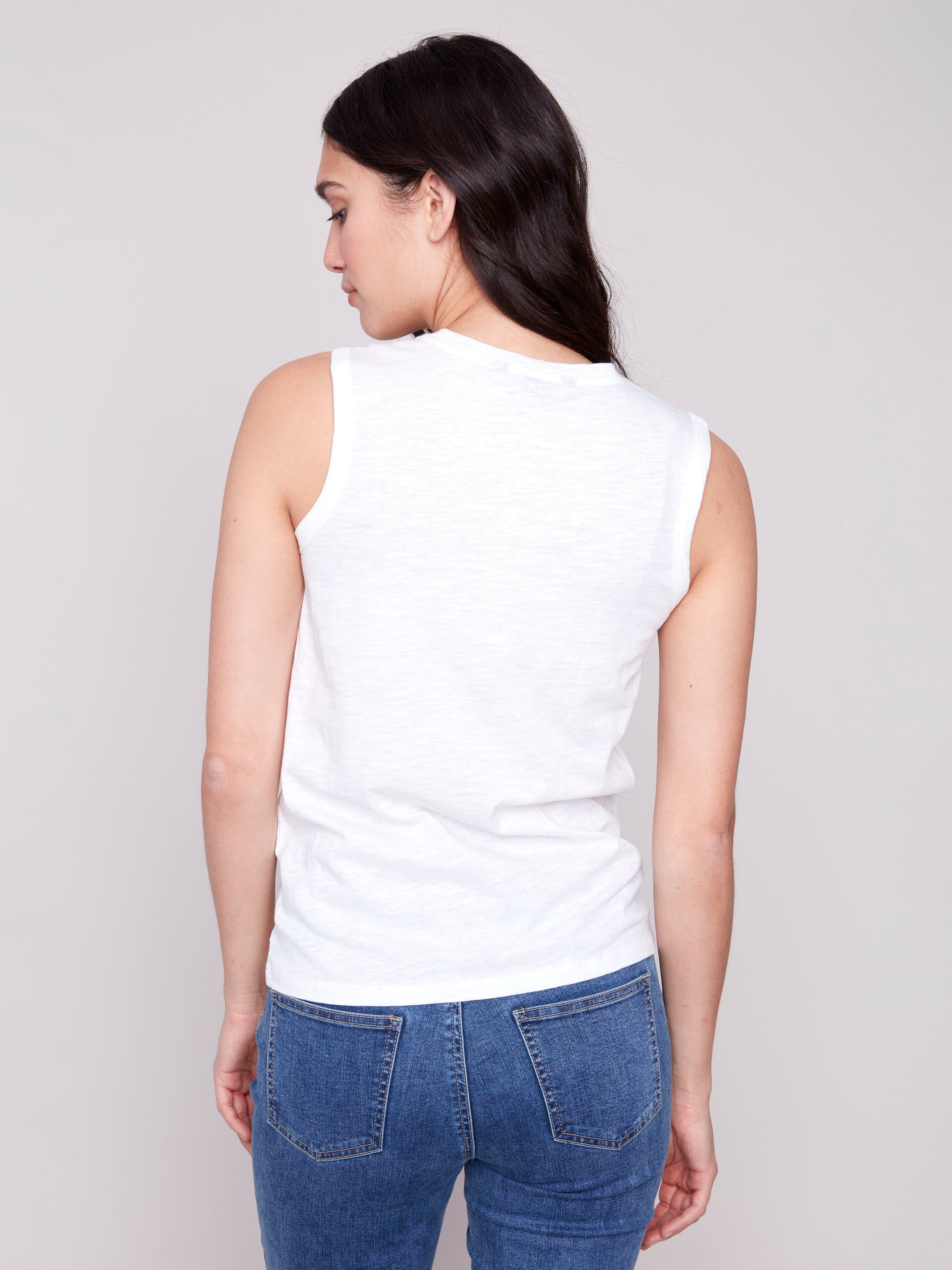 Organic cotton white tank top with cut-out heart detail by Charlie B.