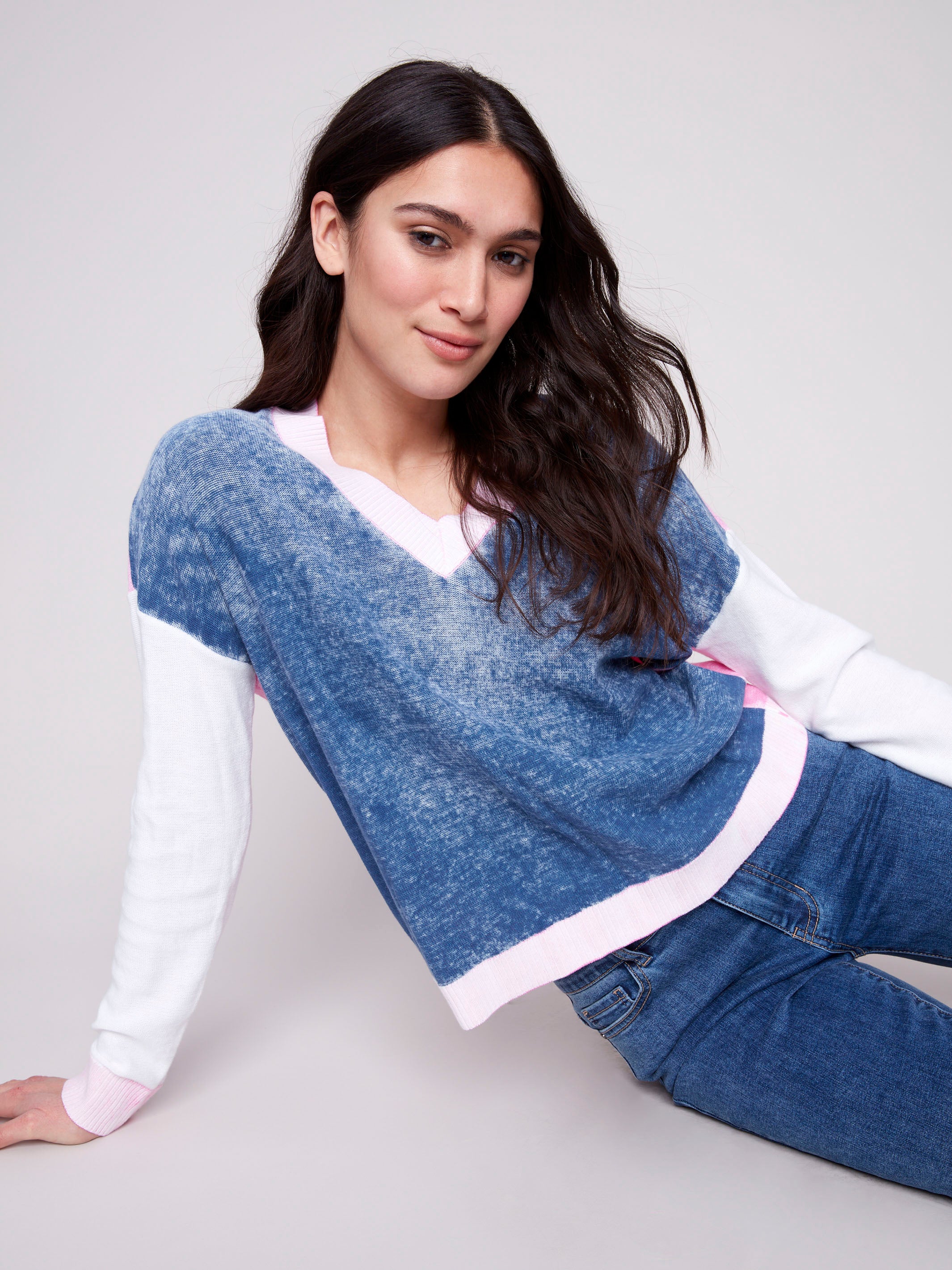 Denim sweater with long sleeves and pink accents, showcasing color-block design by Charlie B.