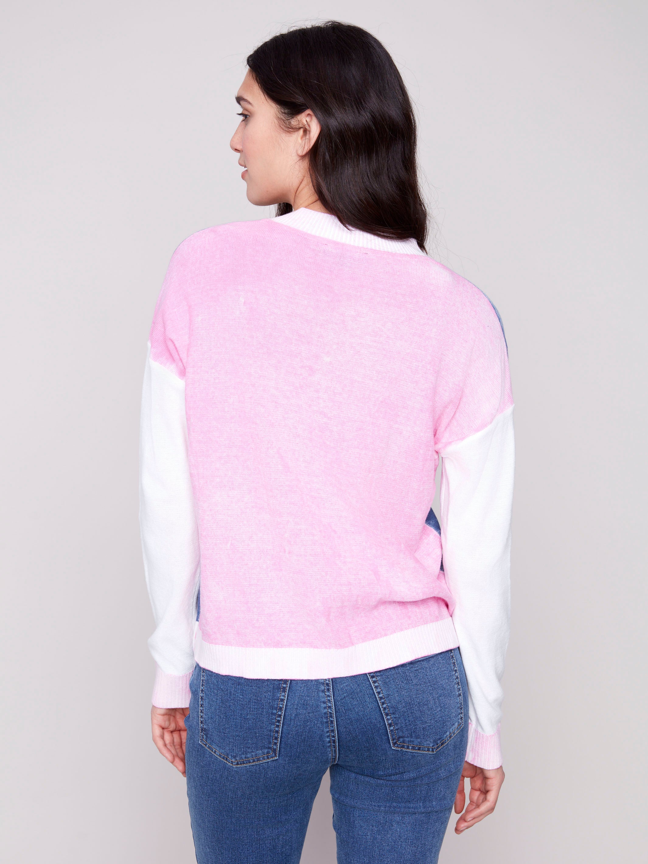 Sweater in denim with white accents and ribbed cuffs, highlighting V-neck style by Charlie B.