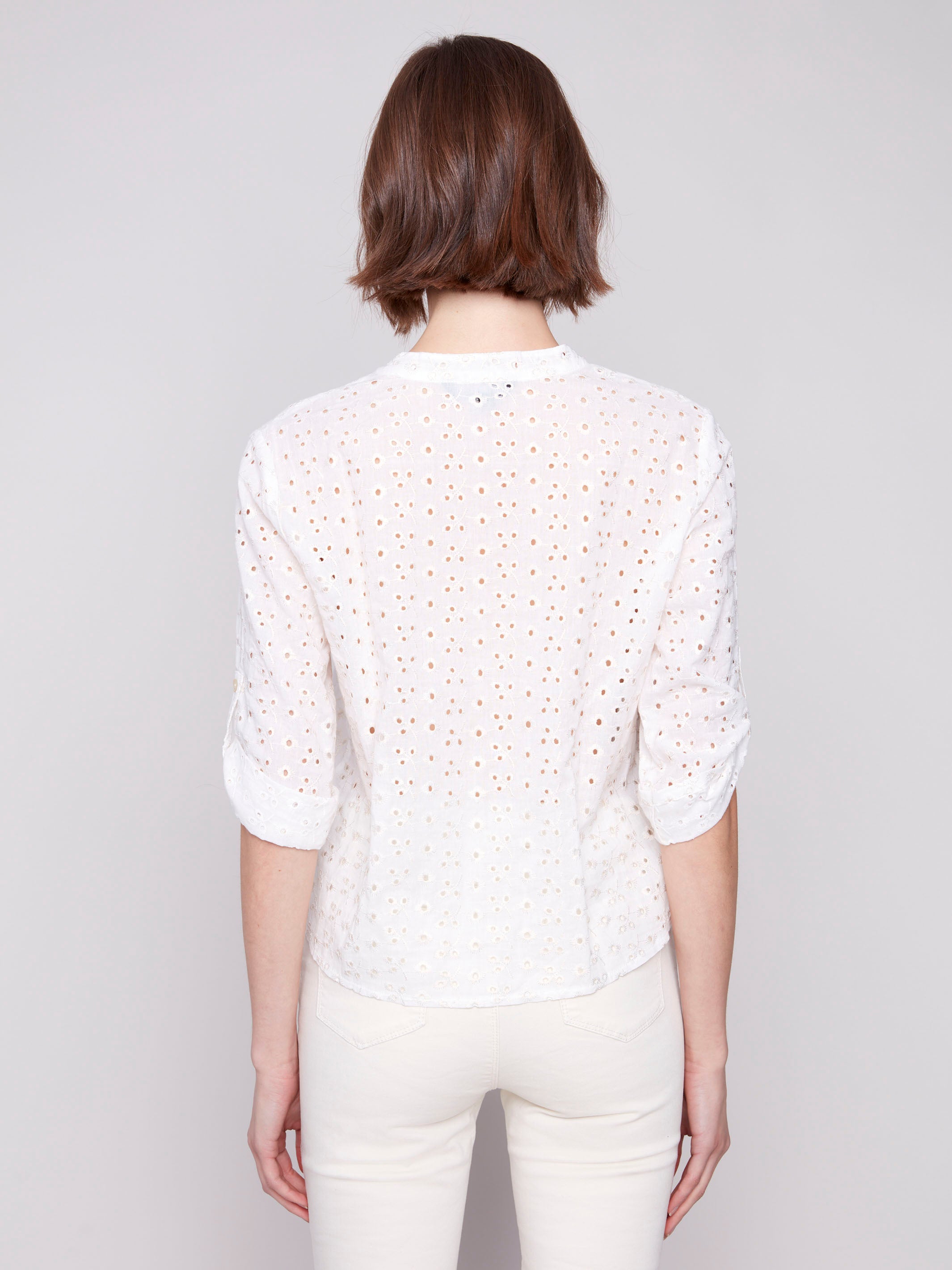 Stylish white blouse in breathable eyelet embroidery by Charlie B.