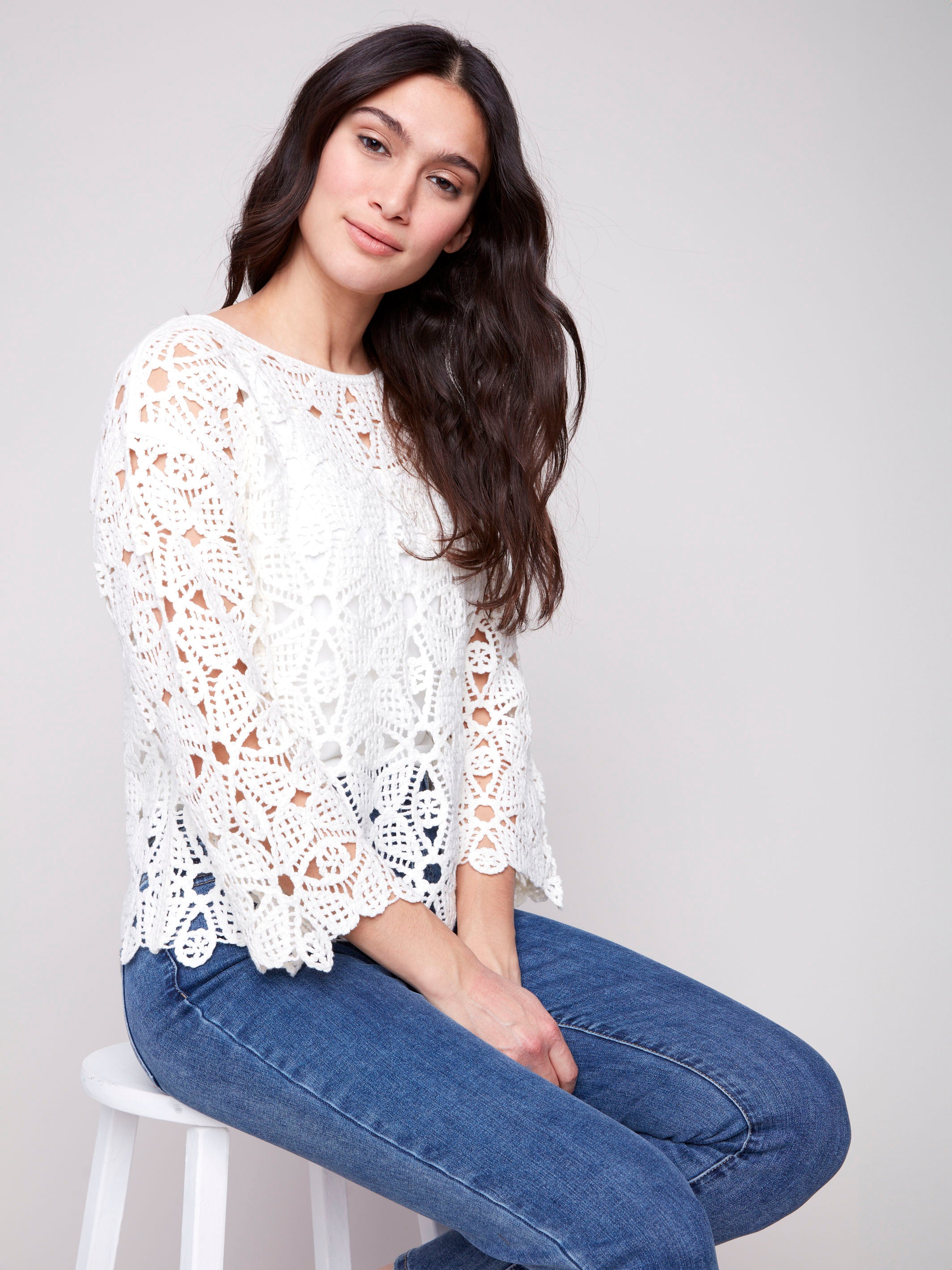 Crochet top featuring a geometric pattern in natural color by Charlie B.