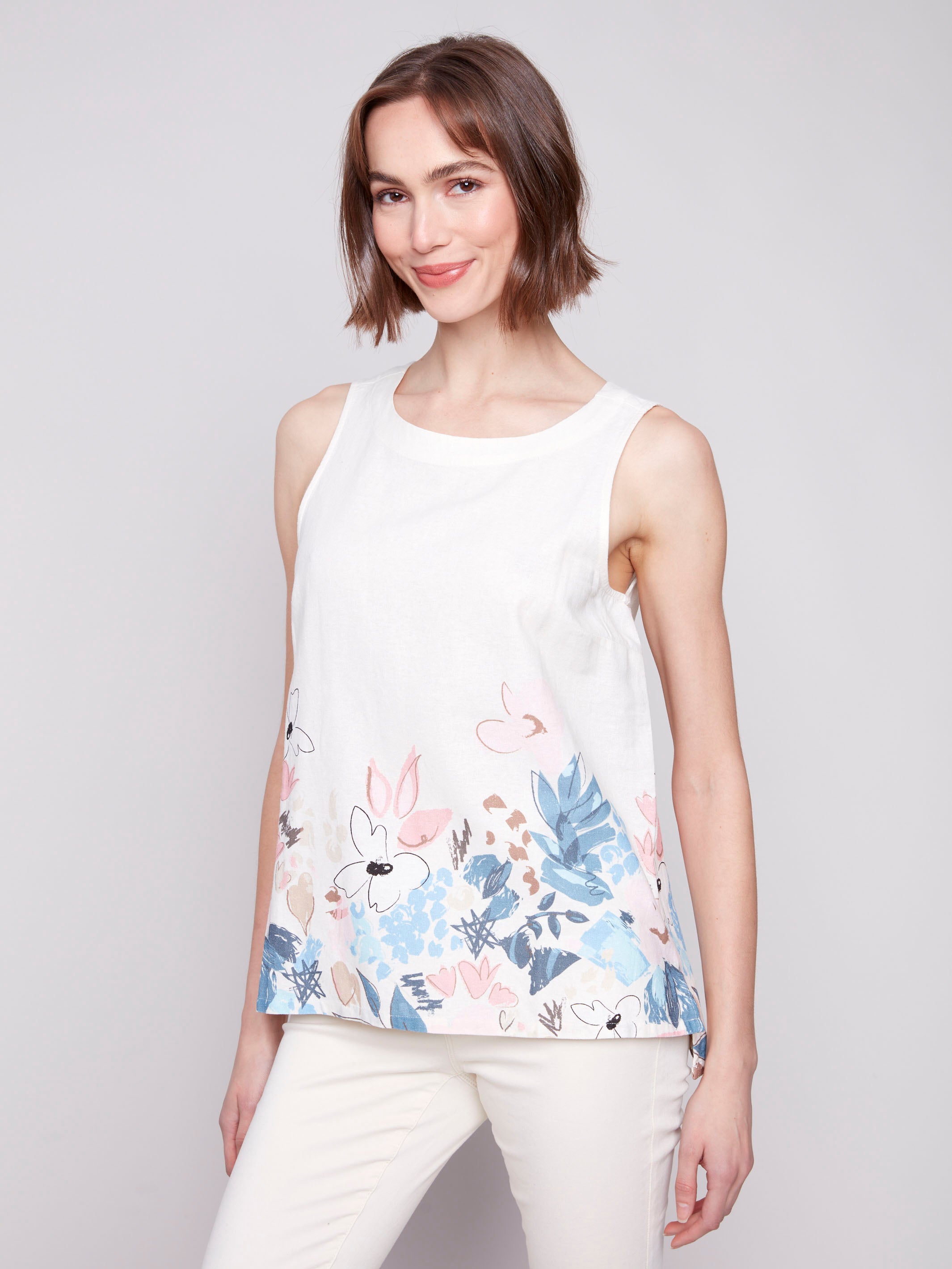 Linen blend top featuring a crew neckline and floral border print by Charlie B.