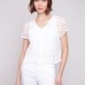 White crochet bolero cardigan with V-neck design by Charlie B.