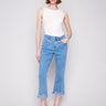 Blue cropped jeans with a fashionable fringed hem and bootcut leg design by Charlie B.