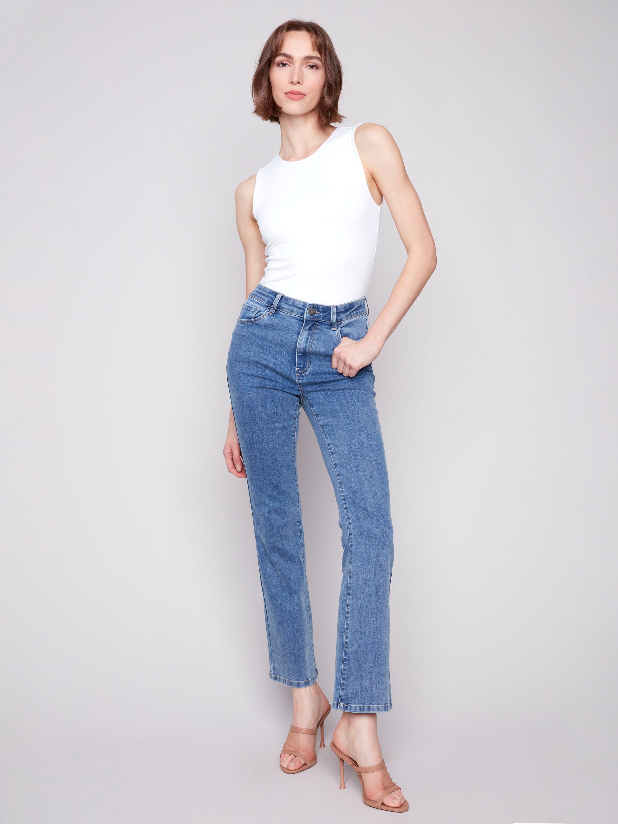 Medium blue Celine flare leg jeans with a classic five-pocket design by Charlie B.