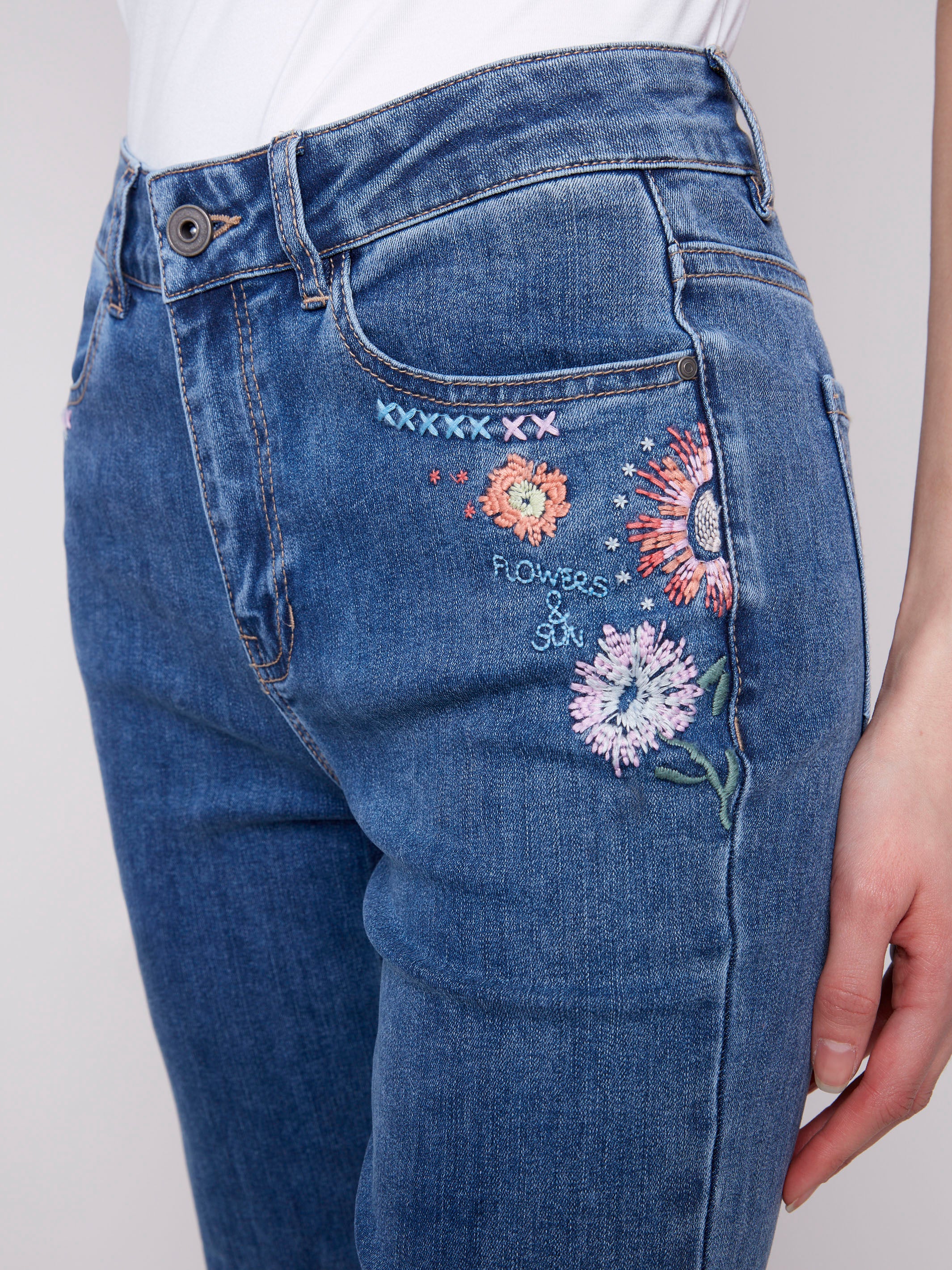 Five-pocket medium blue jeans crafted for comfort by Charlie B.