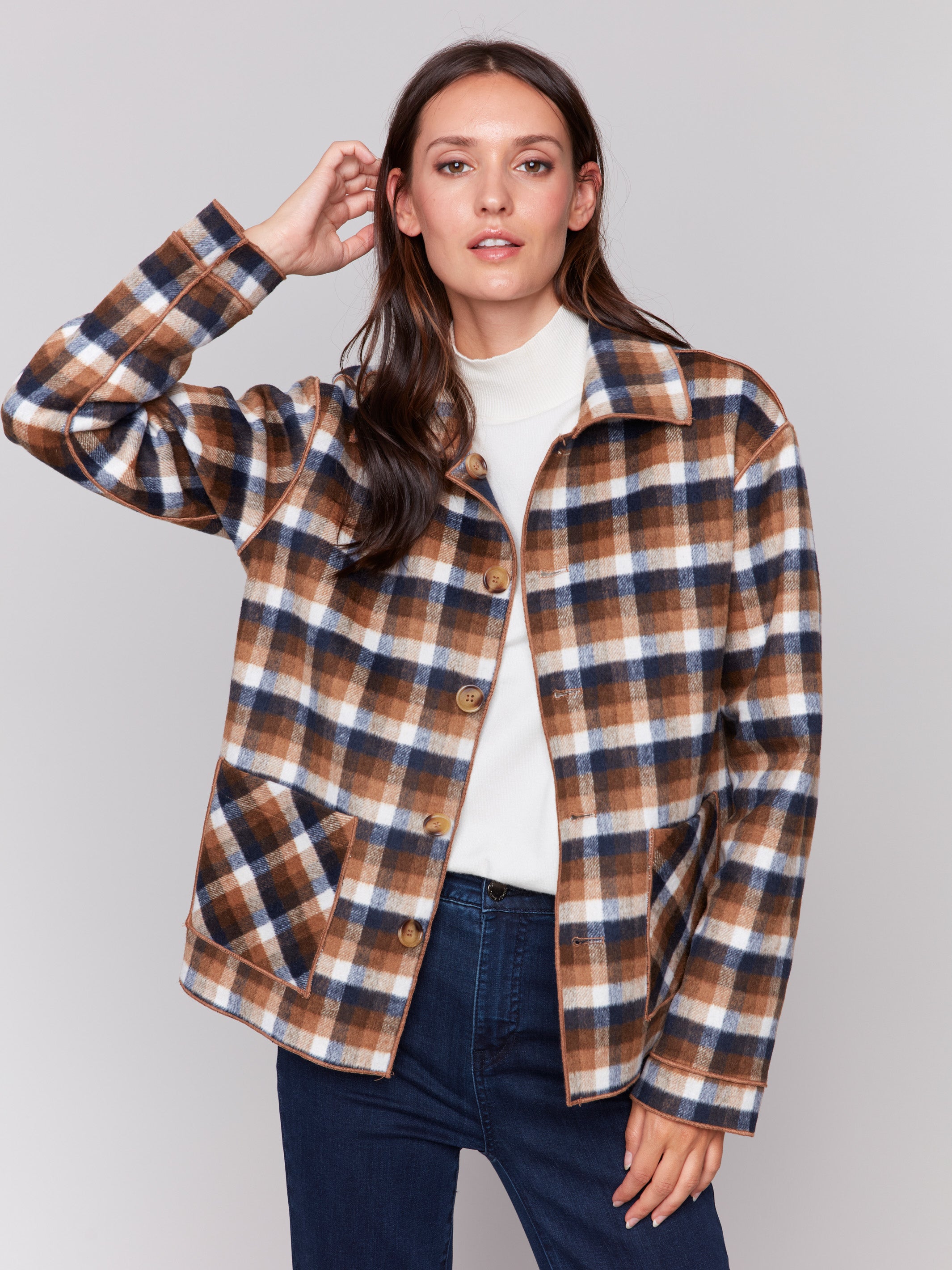 Reversible plaid jacket with button front and patch pockets by Charlie B. Demonstrated in a plaid pattern on each side, in shades of Truffle.