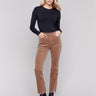 Truffle-colored bootcut corduroy pants with an asymmetrical frayed hem and a bootcut fit by Charlie B.