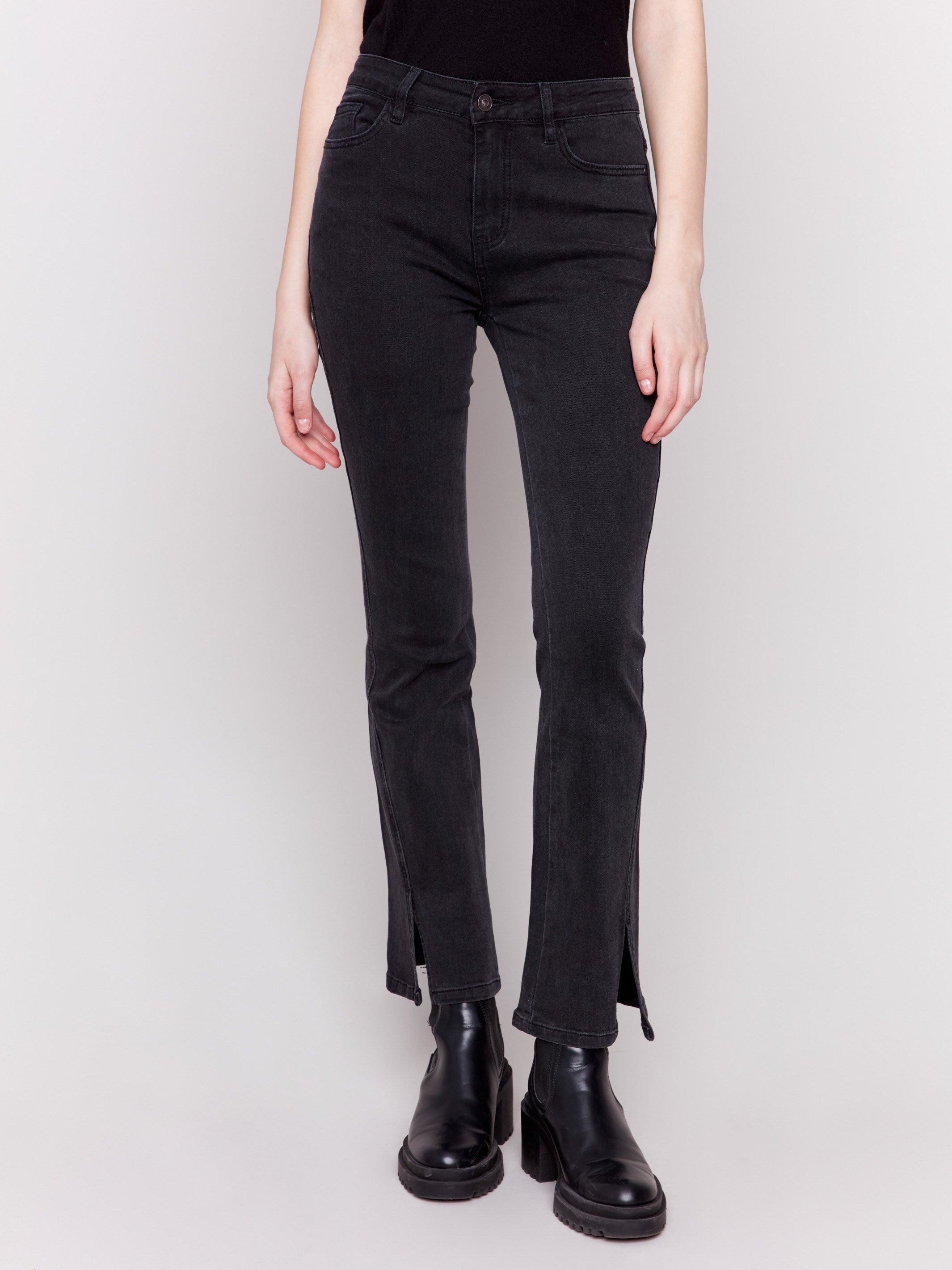 Charcoal black bootcut jeans with front slits, regular rise, and a five-pocket design by Charlie B.