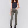 Spruce green bootcut twill pants with an asymmetrical fringe hem and mid-rise waist by Charlie B.