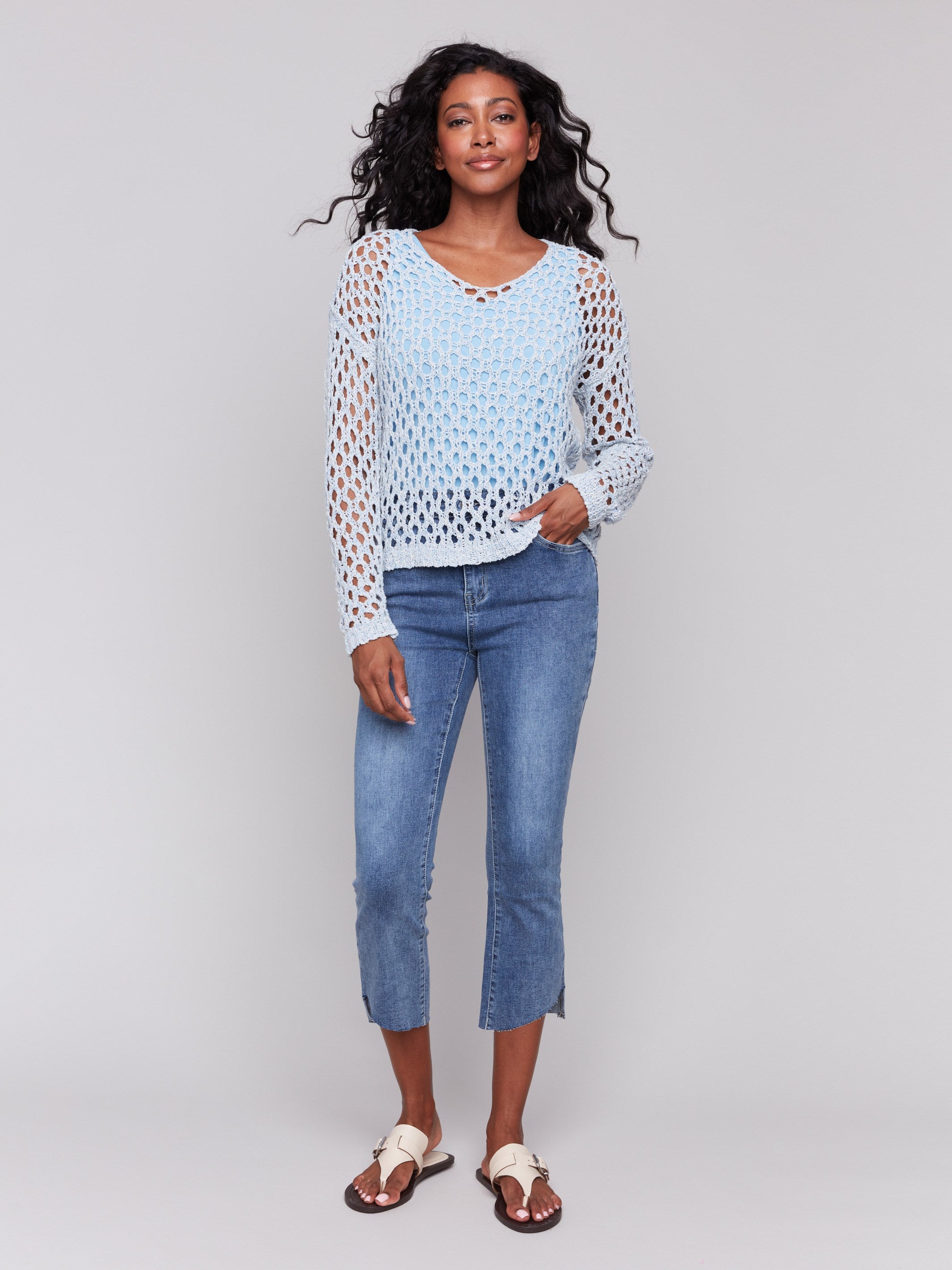 Denim sweater showcasing elegant long sleeves by Charlie B.