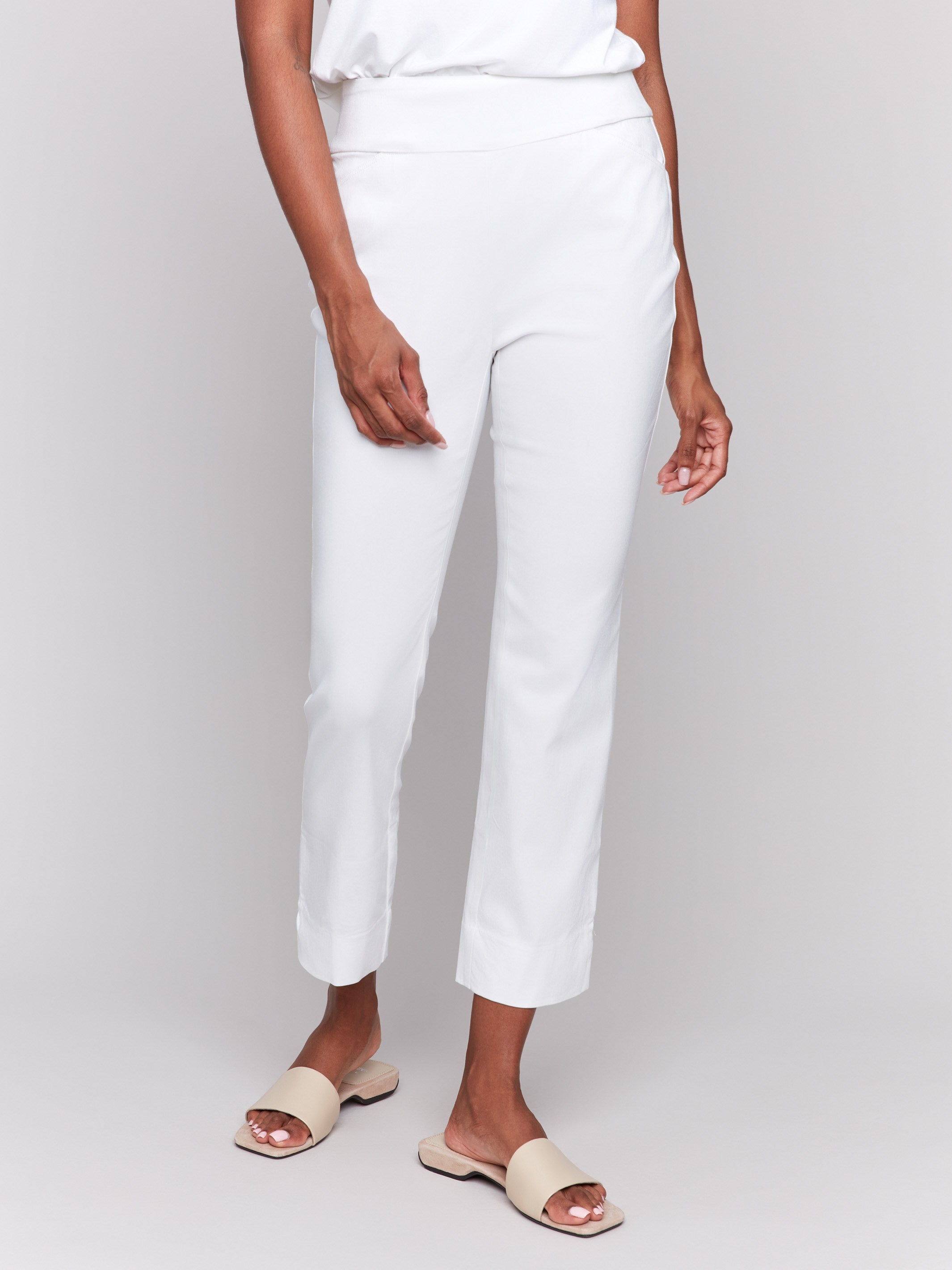 White capri pants with hem slit and side pockets by Charlie B.