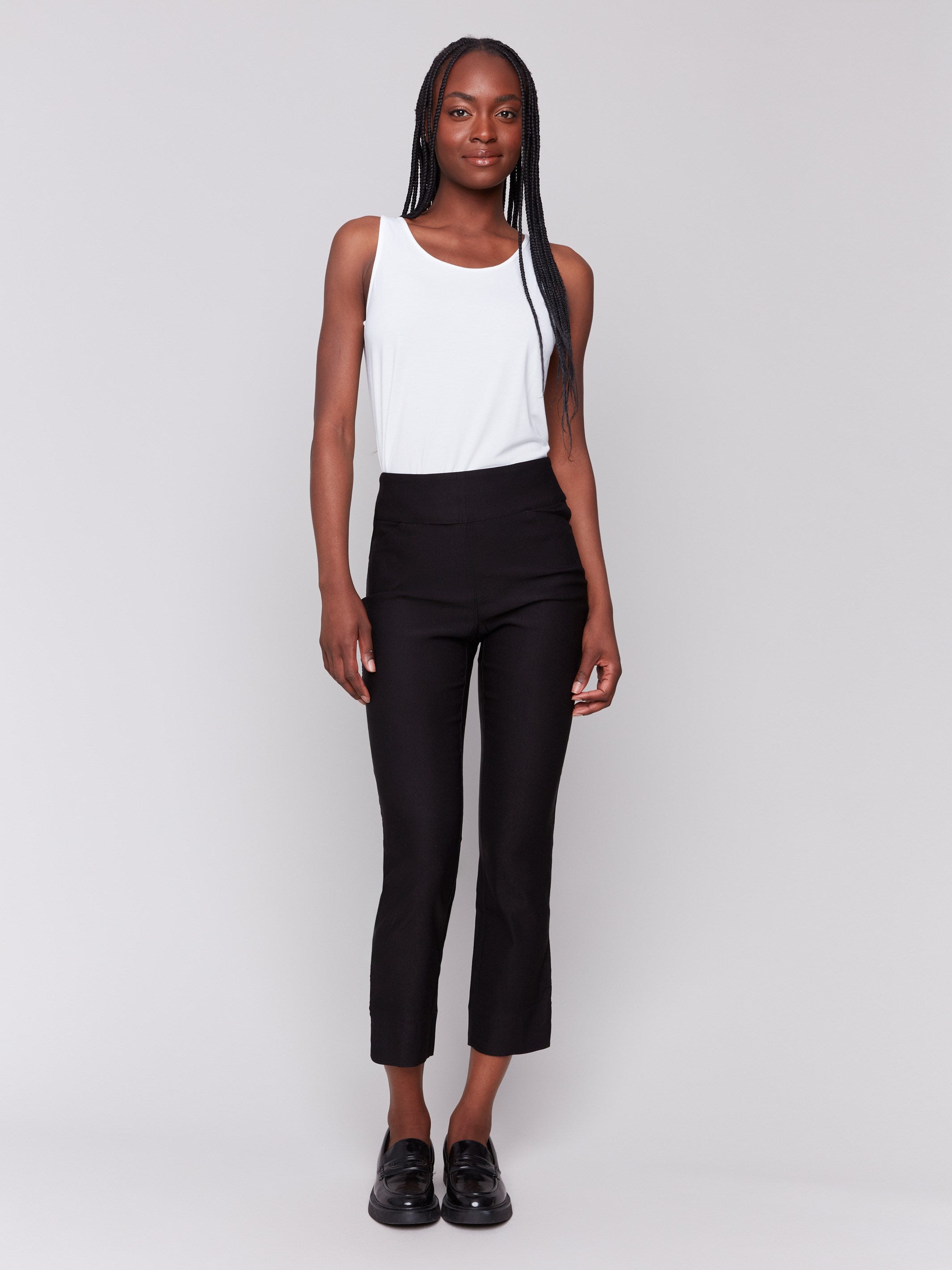 Black capri pants with hem slit and side pockets by Charlie B.