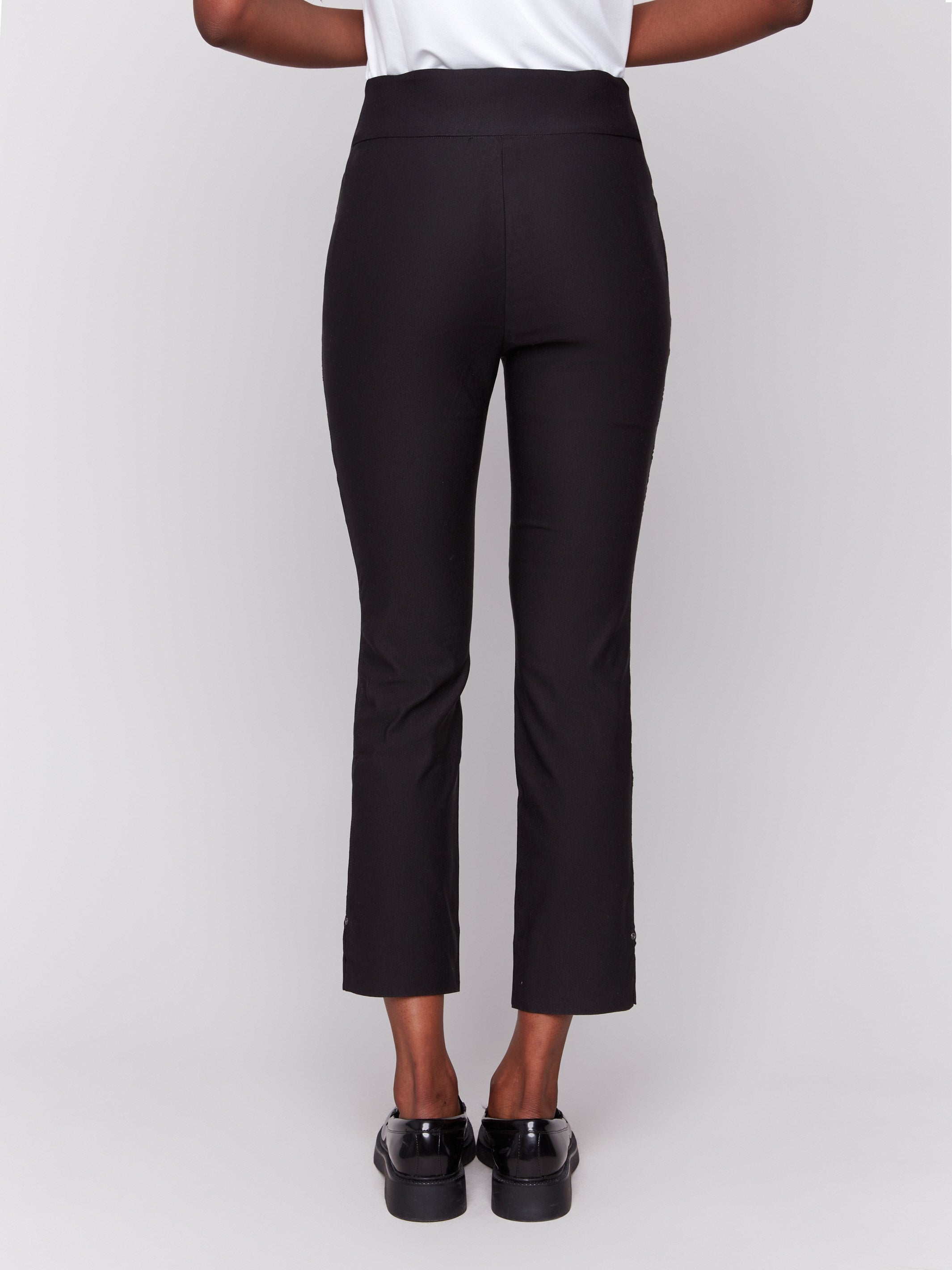 Black capri pants with hem slit and side pockets by Charlie B.