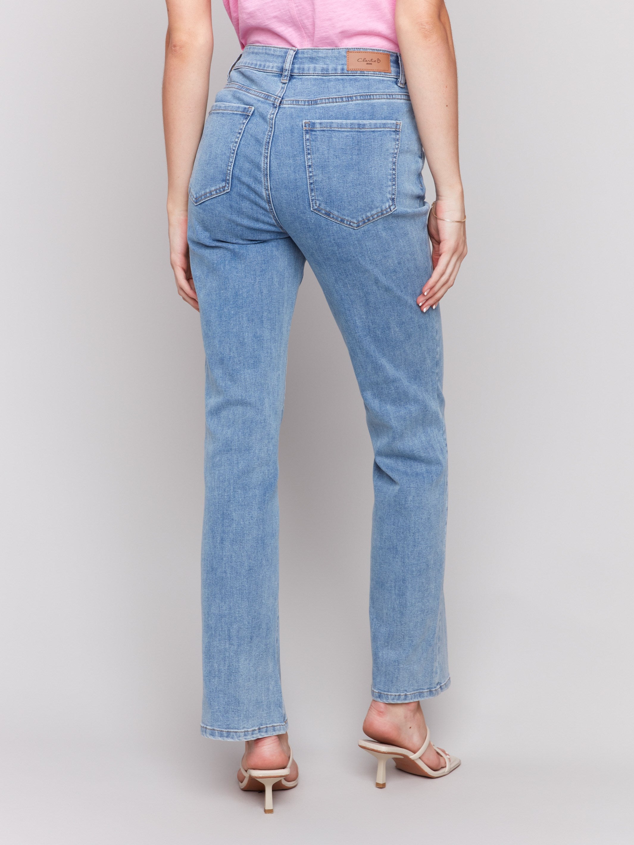 Light blue Celine flare leg jeans with a classic five-pocket design by Charlie B.