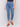 Medium blue slim leg jeans with five-pocket design and button closure by Charlie B.