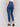 Indigo slim leg jeans with five-pocket design and button closure by Charlie B.