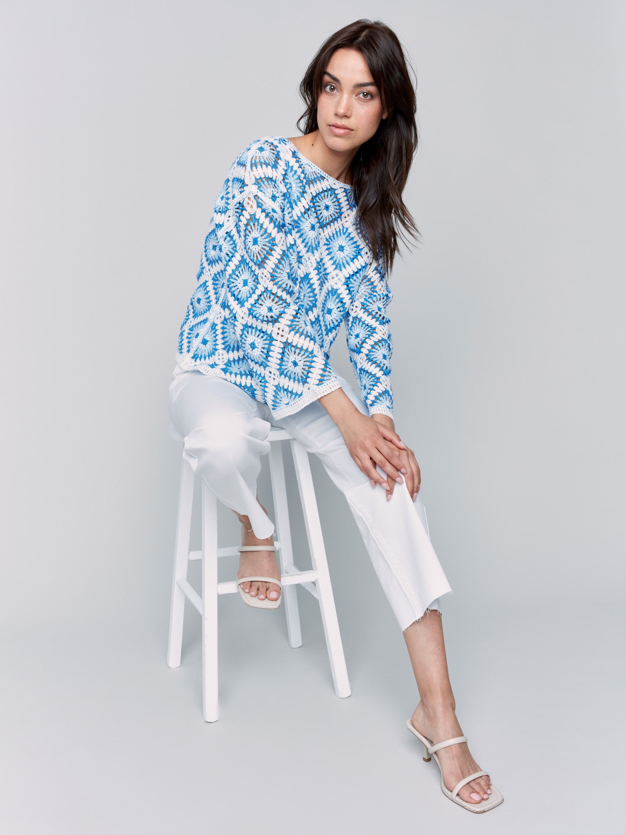 Blue and white crochet design with intricate patterns for a chic look by Charlie B.