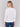 Stylish white sweater featuring colorful floral patches by Charlie B.