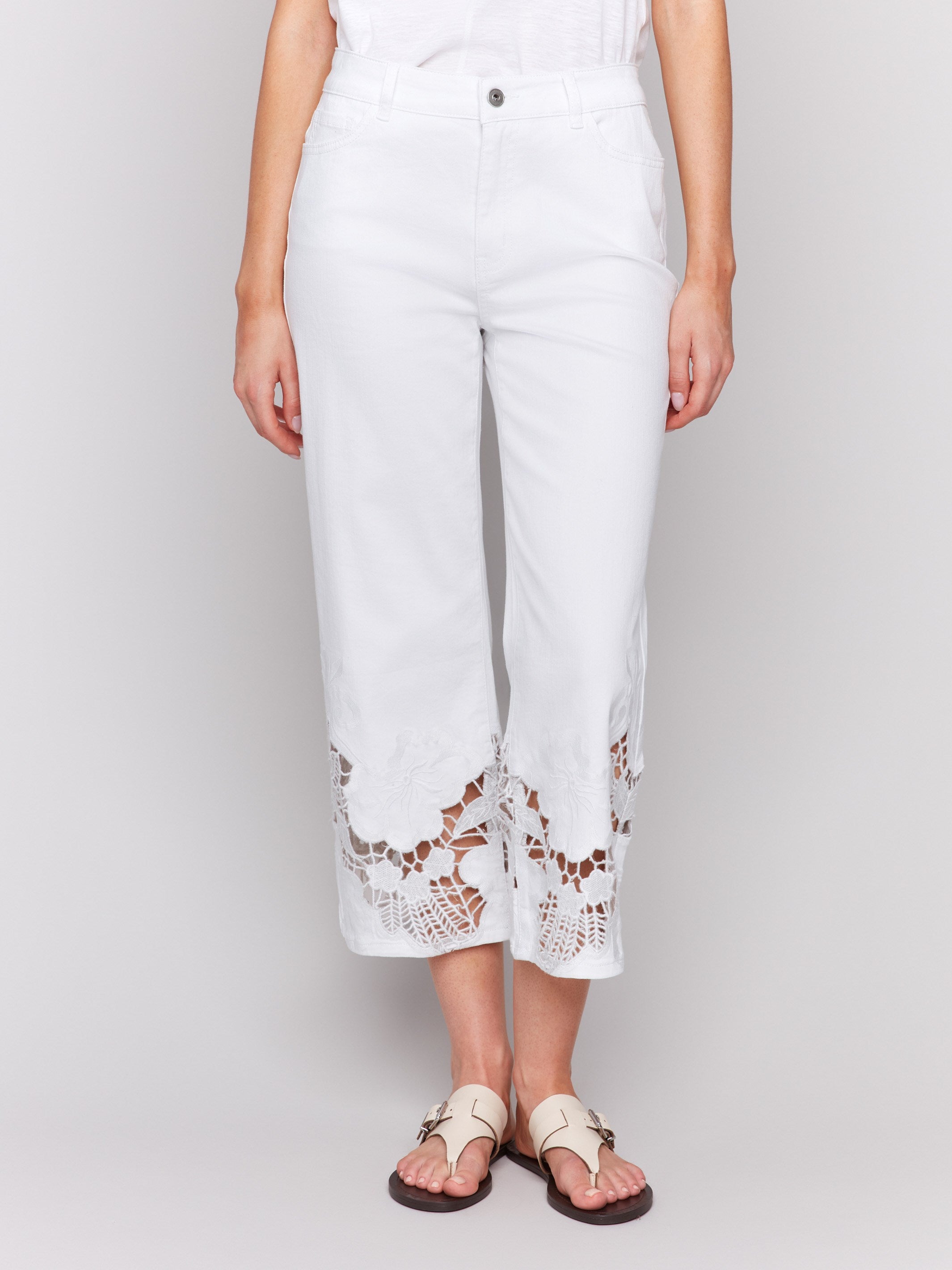 White flare jeans featuring stretch denim material by Charlie B.