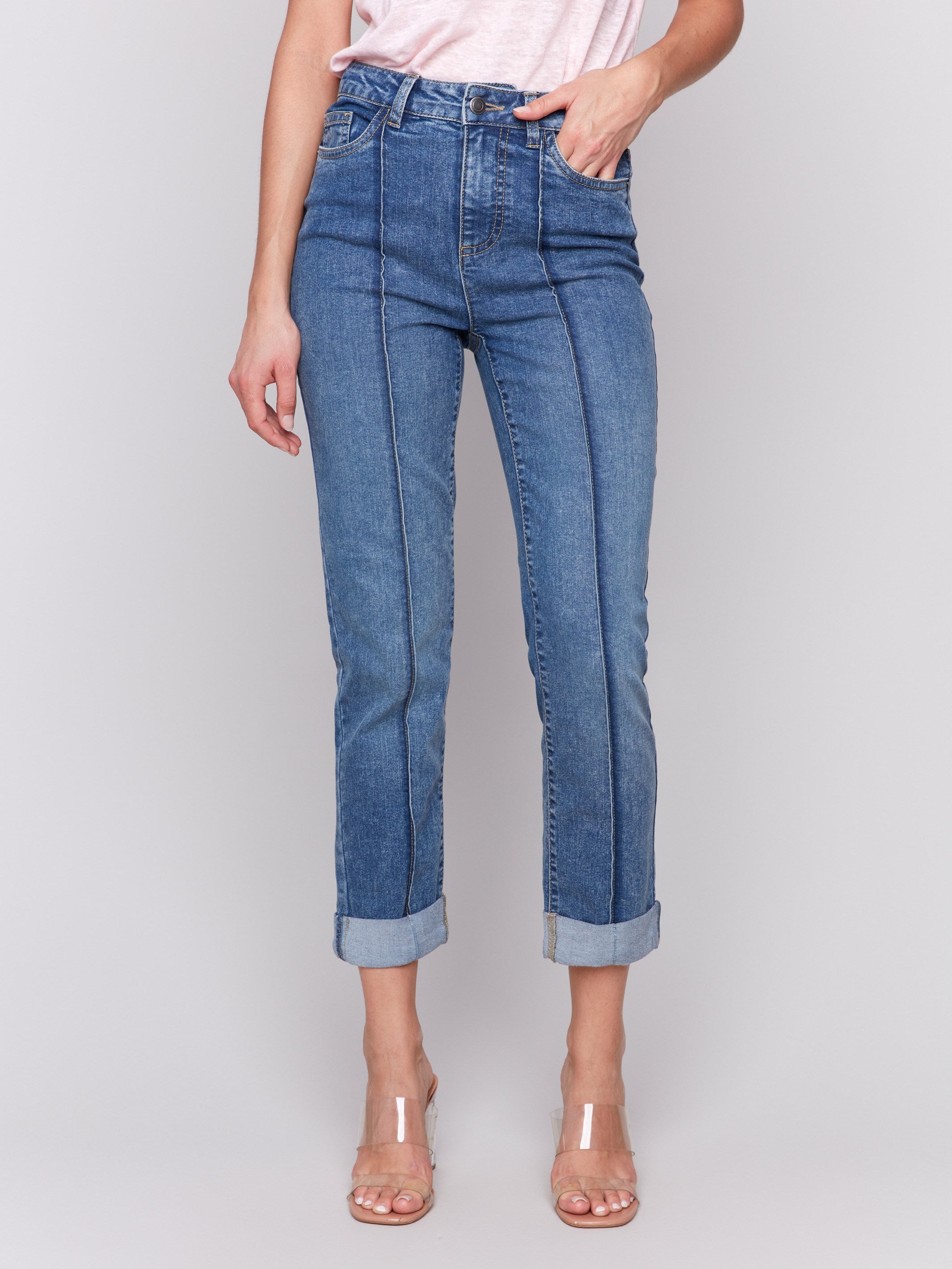 Medium blue jeans featuring a five-pocket design by Charlie B.