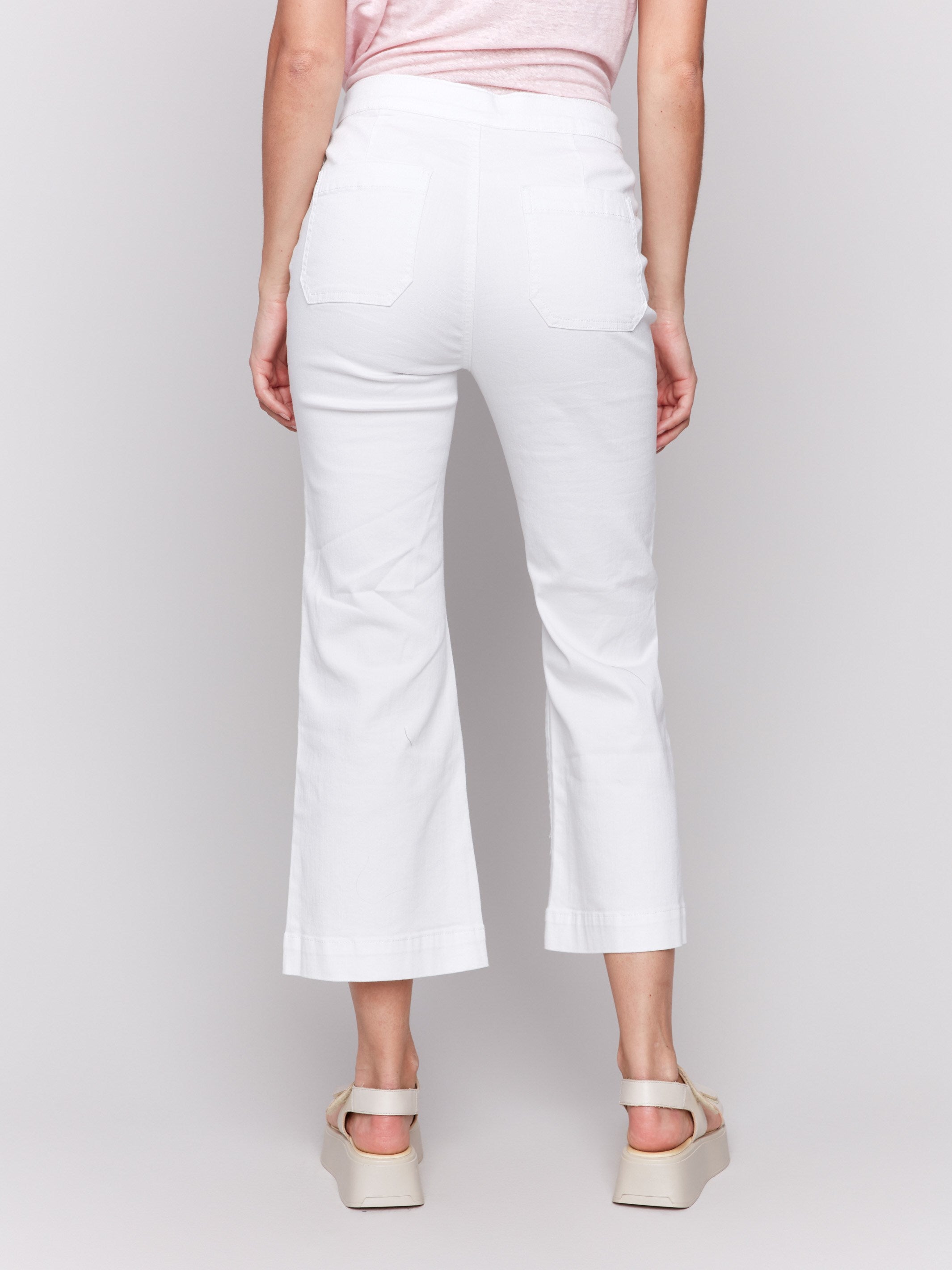 White jeans with flare fit and stylish design by Charlie B.