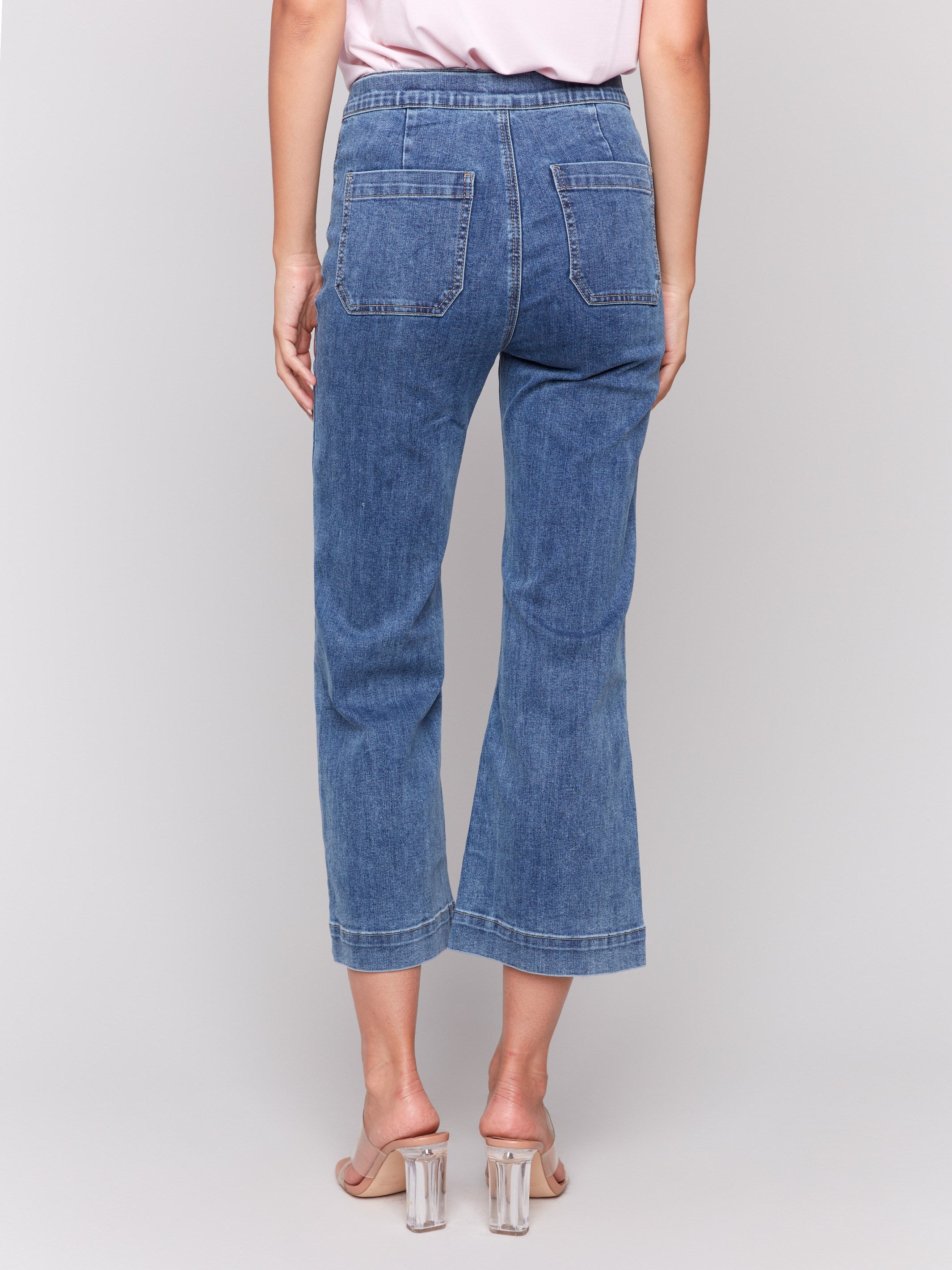 Cropped length jeans featuring front button details by Charlie B.