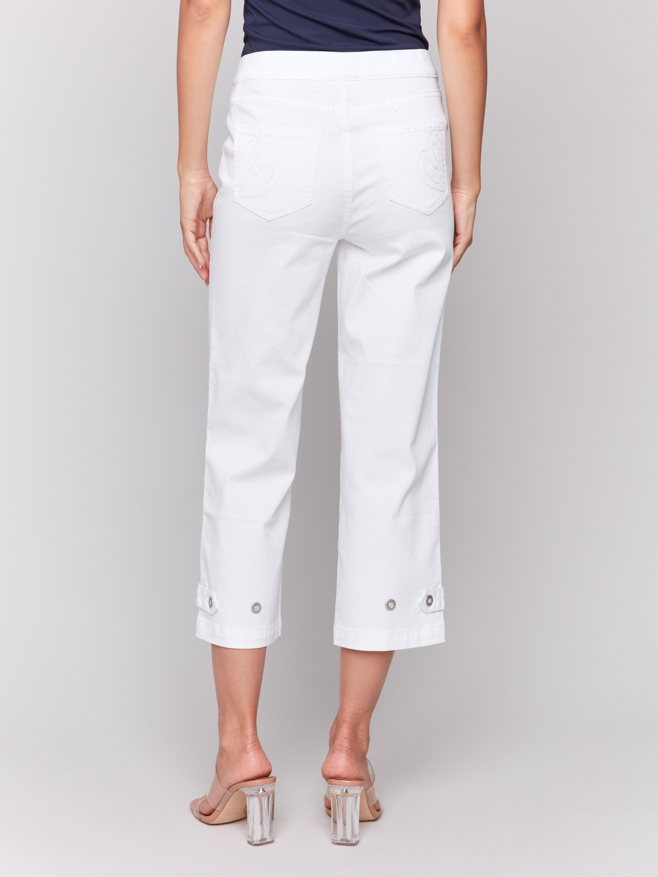 White pants with two back pockets and regular rise waist by Charlie B.