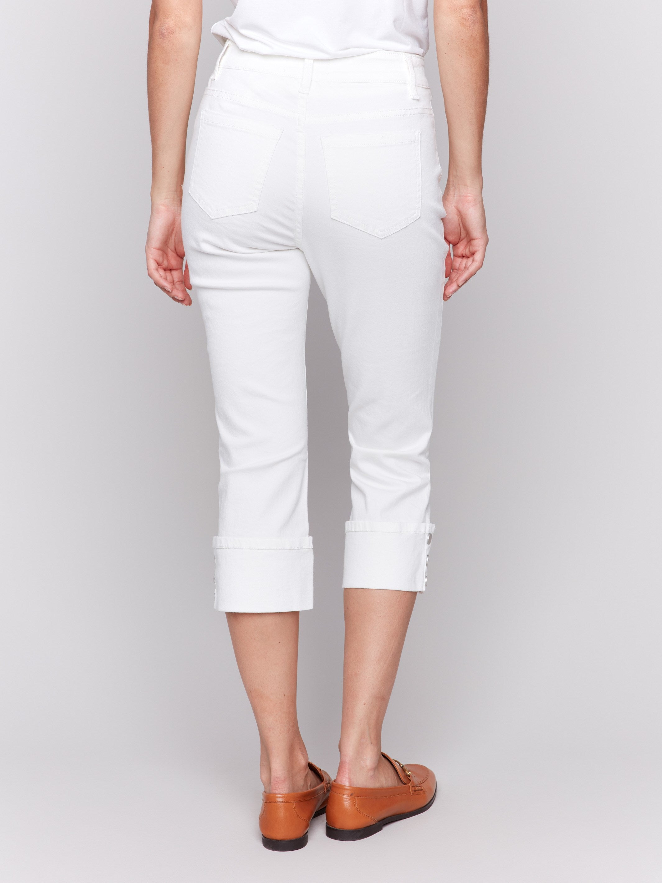 Versatile cropped length white jeans offering a modern narrow leg silhouette by Charlie B.