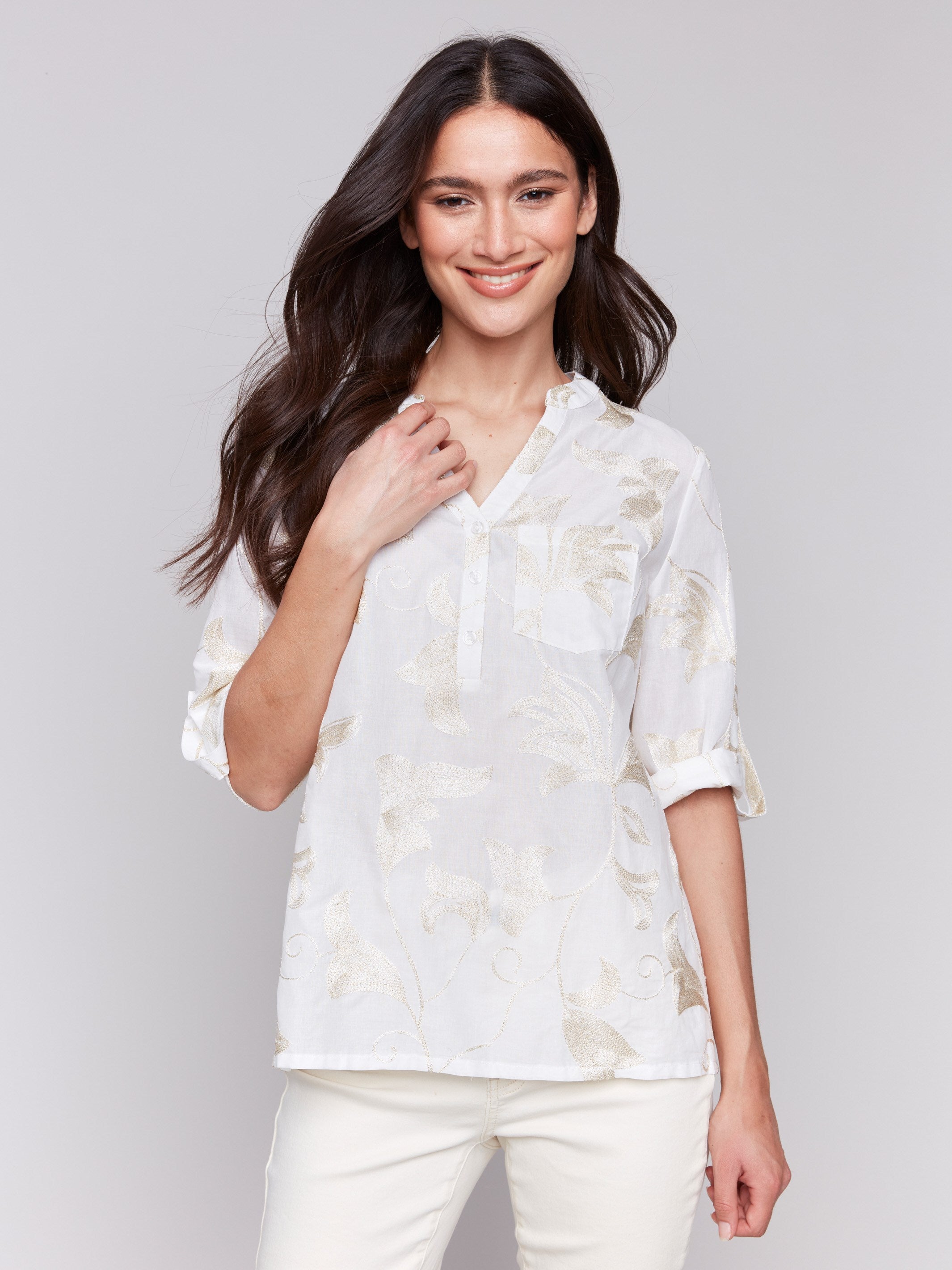 Blouse with intricate gold embroidery and half-button front by Charlie B.