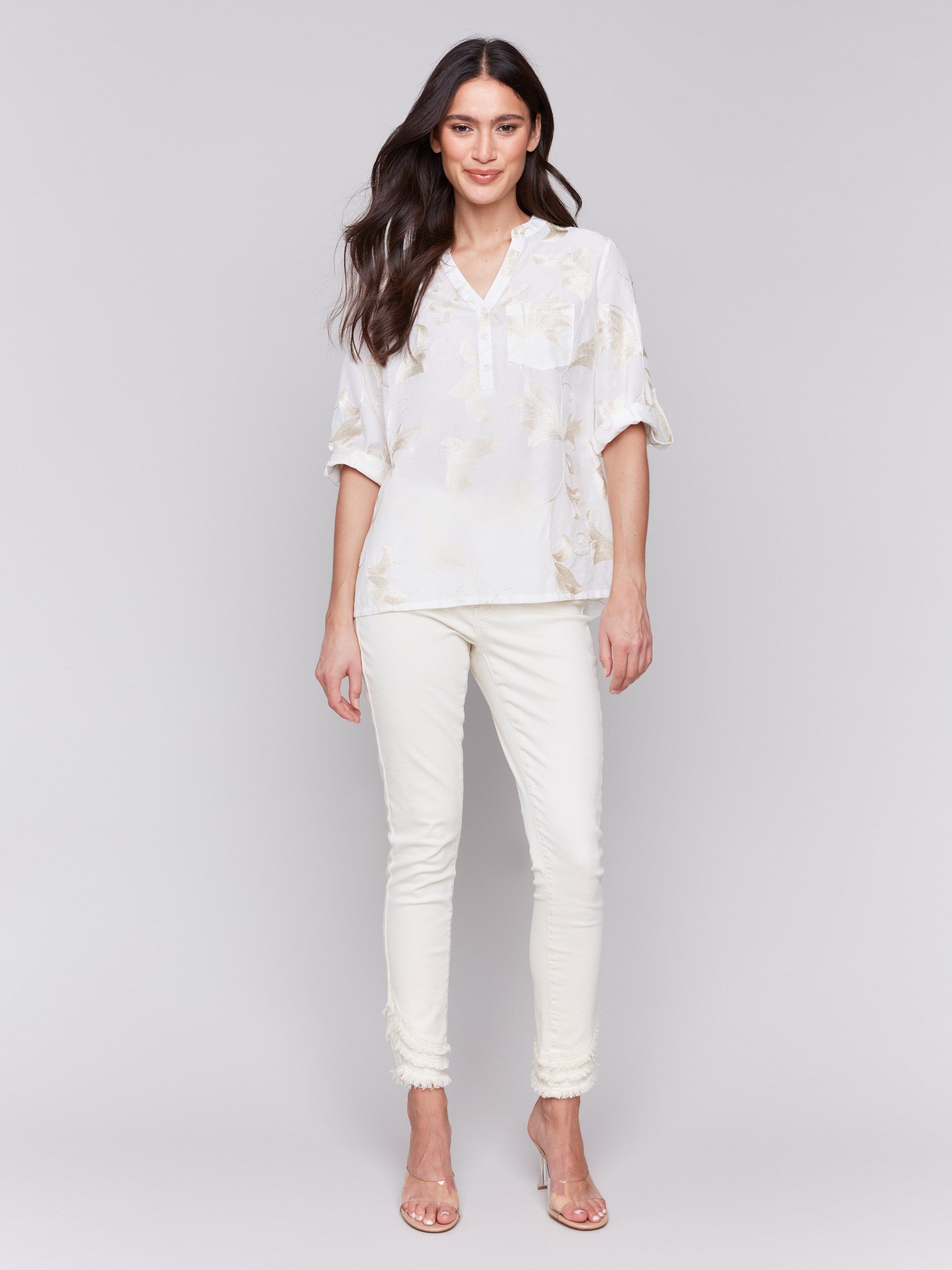 Elegant white blouse with a chest pocket and gold details by Charlie B.