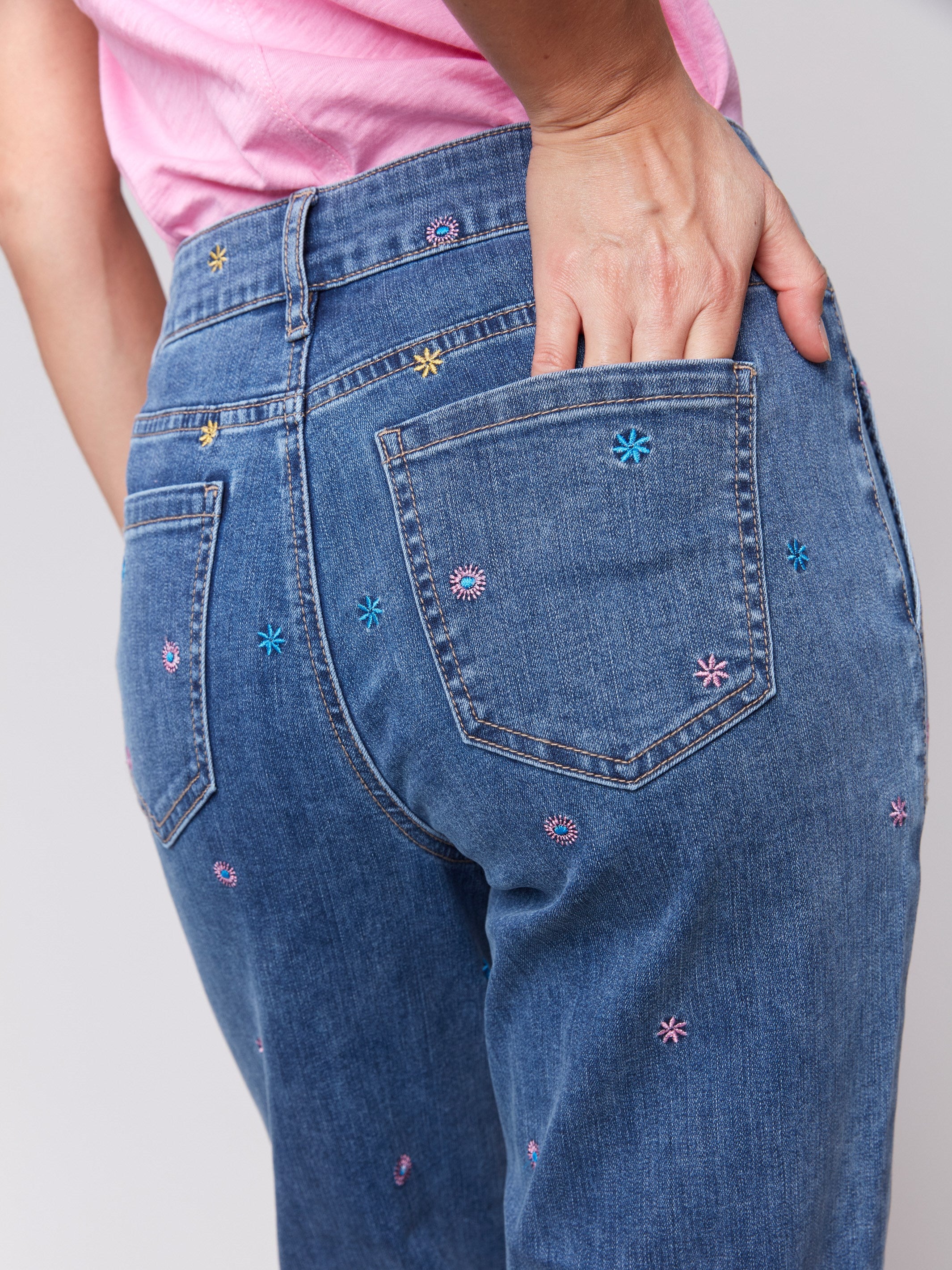 Utility style pockets on medium blue jeans in a straight fit by Charlie B.