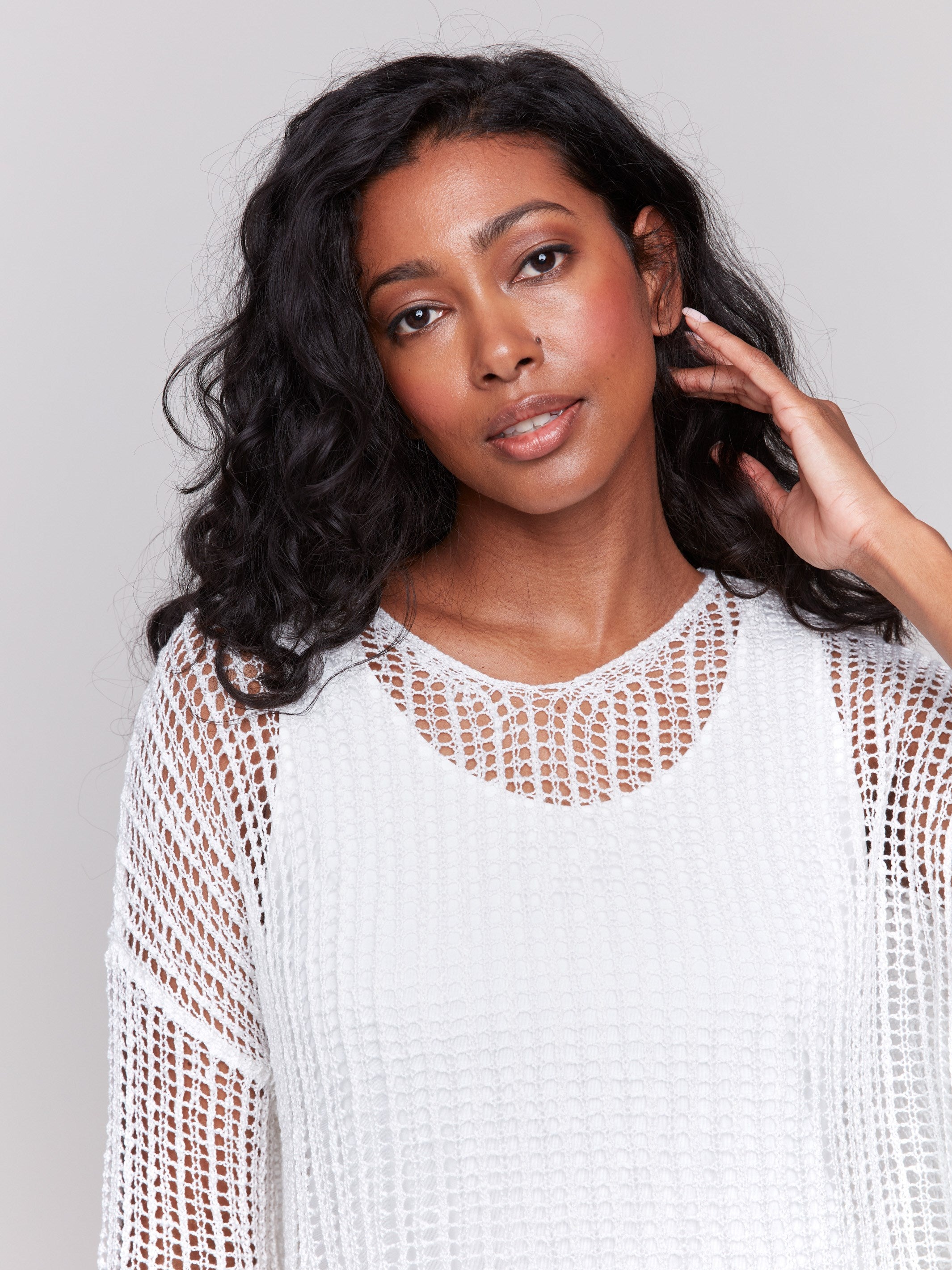 White fishnet crochet sweater featuring a relaxed V-neck by Charlie B.