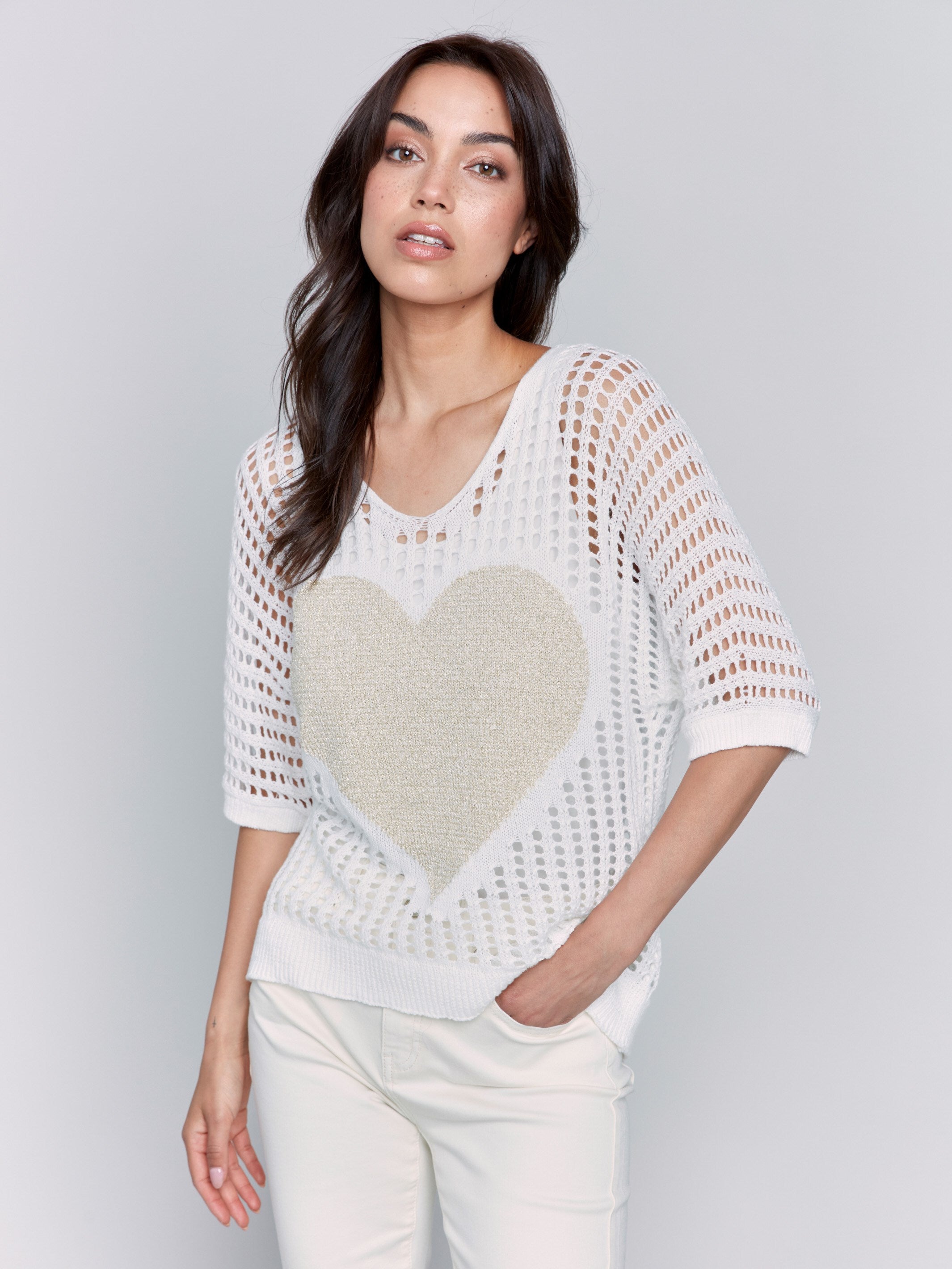 White fishnet V-neck sweater with a gold heart design and 3/4 dolman sleeves by Charlie B.