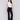 Woman wearing black flare ponte pants with side slits by Charlie B.