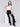 Woman wearing black flare ponte pants with side slits by Charlie B.