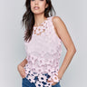 Pink crochet top with a crew neckline and charming floral details by Charlie B.