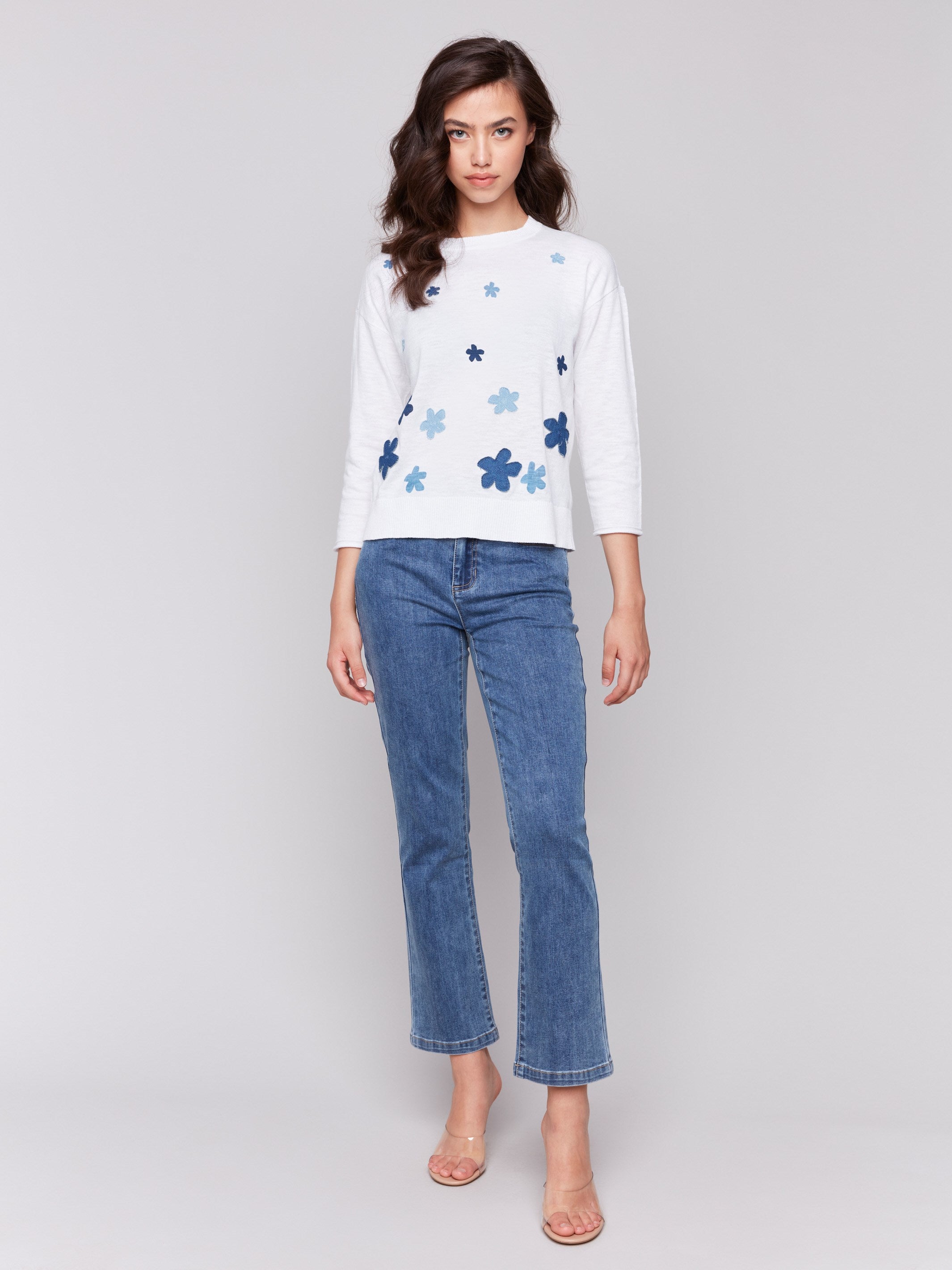 Elegant cotton sweater adorned with unique floral denim patches by Charlie B.