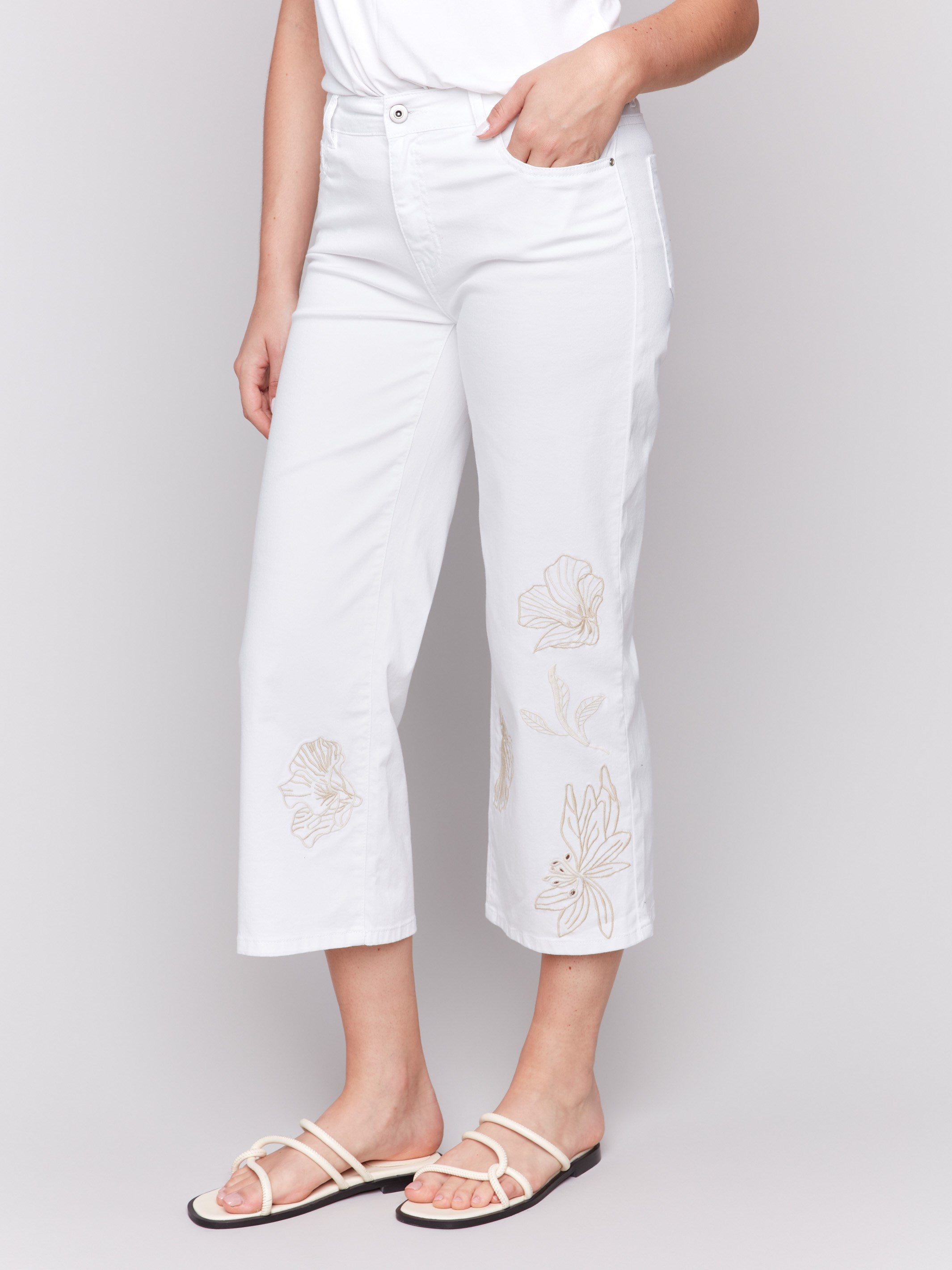 Stylish flare fit white pants featuring five-pocket design by Charlie B.