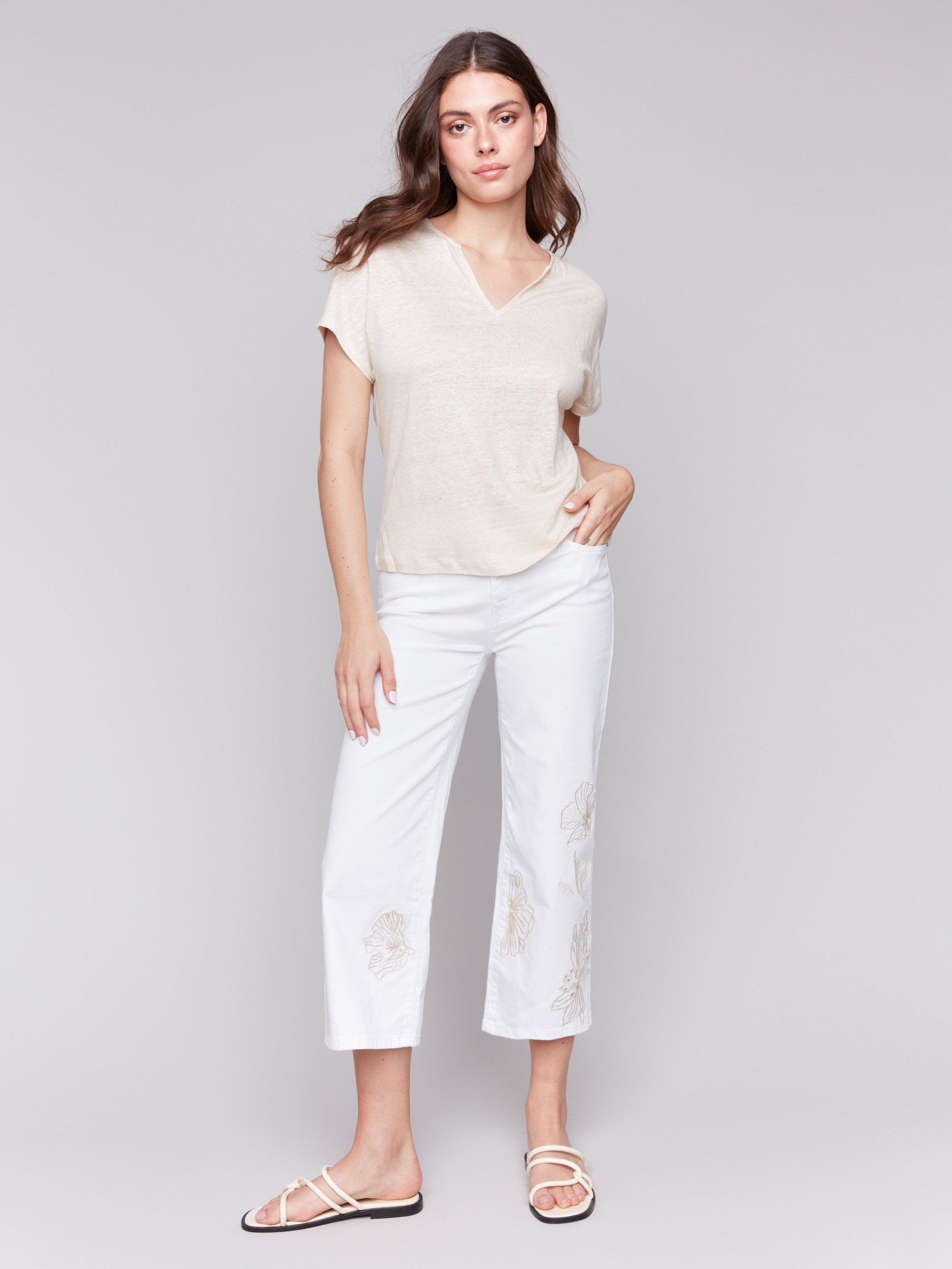 Cropped length white pants with stretch twill fabric by Charlie B.