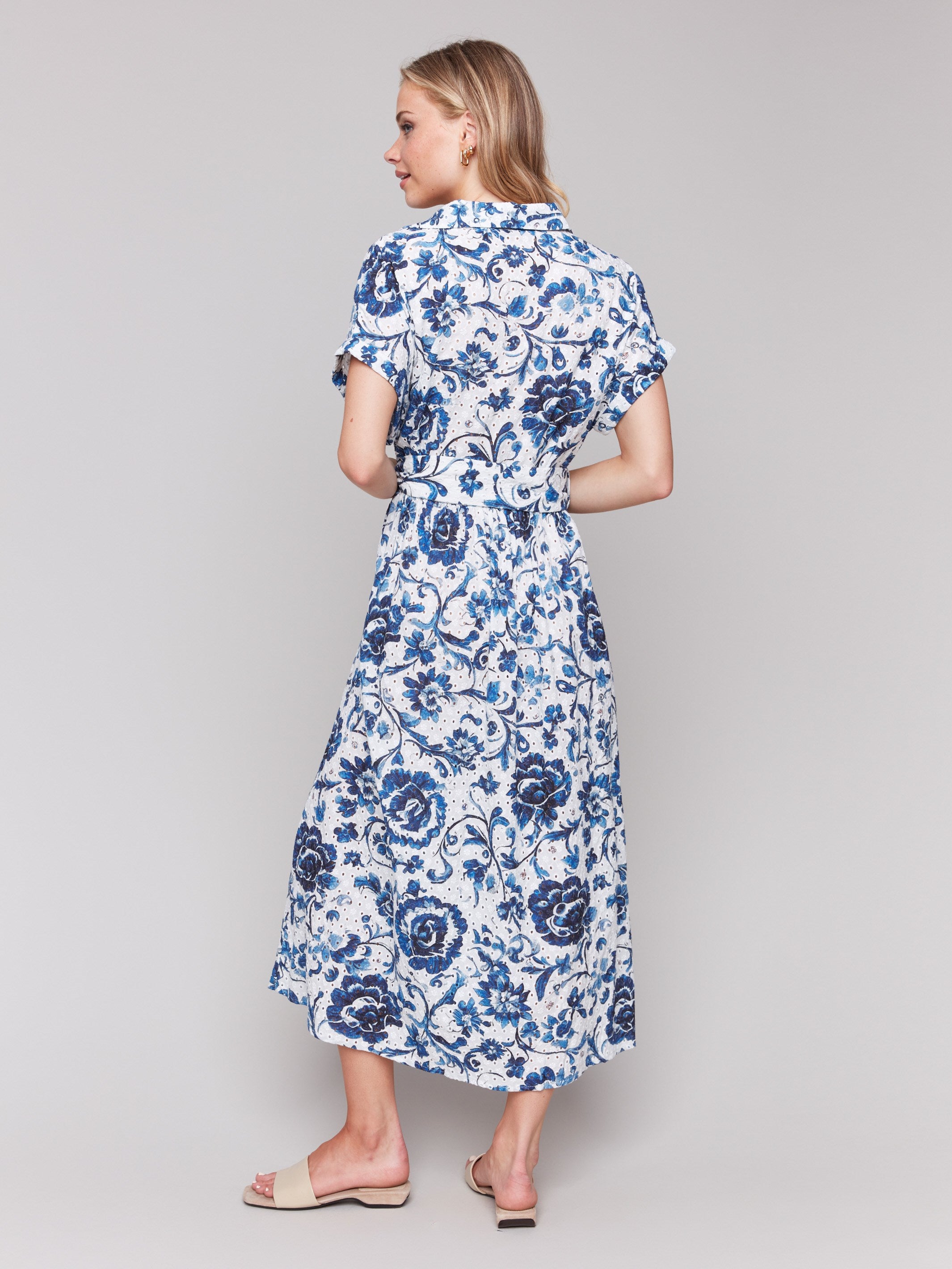 Maxi length floral dress showcasing a unique button-front detail by Charlie B.