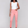 Watermelon-colored slim fit twill pants with a frayed hem, ankle-length and mid-rise design by Charlie B.