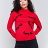 Cranberry red mock neck sweater with 'happy life' text design in plush knit by Charlie B.