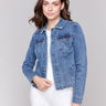 Medium blue denim jacket with frayed edges and front pockets by Charlie B.