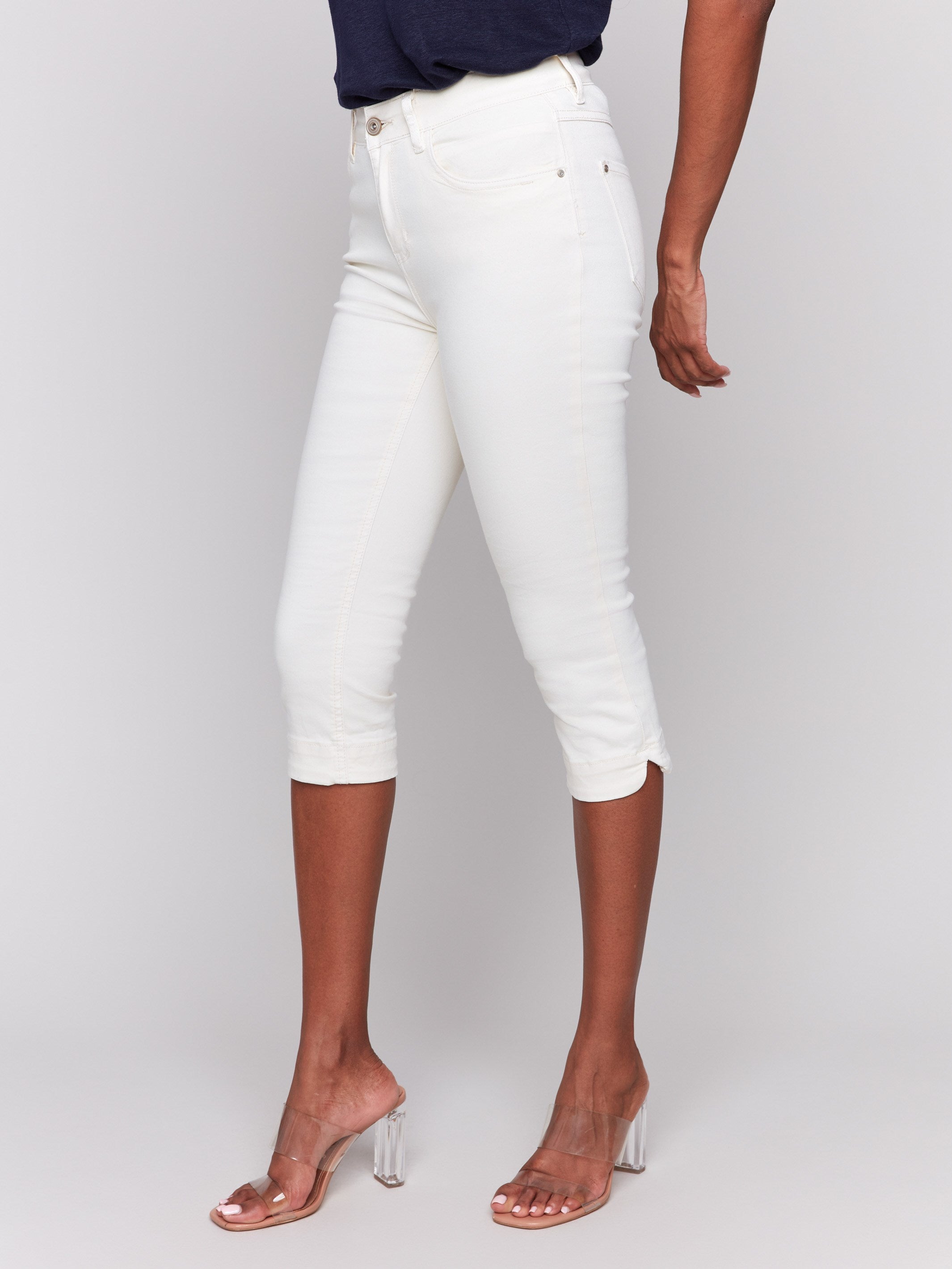 Classic five-pocket design on natural capri pants by Charlie B.