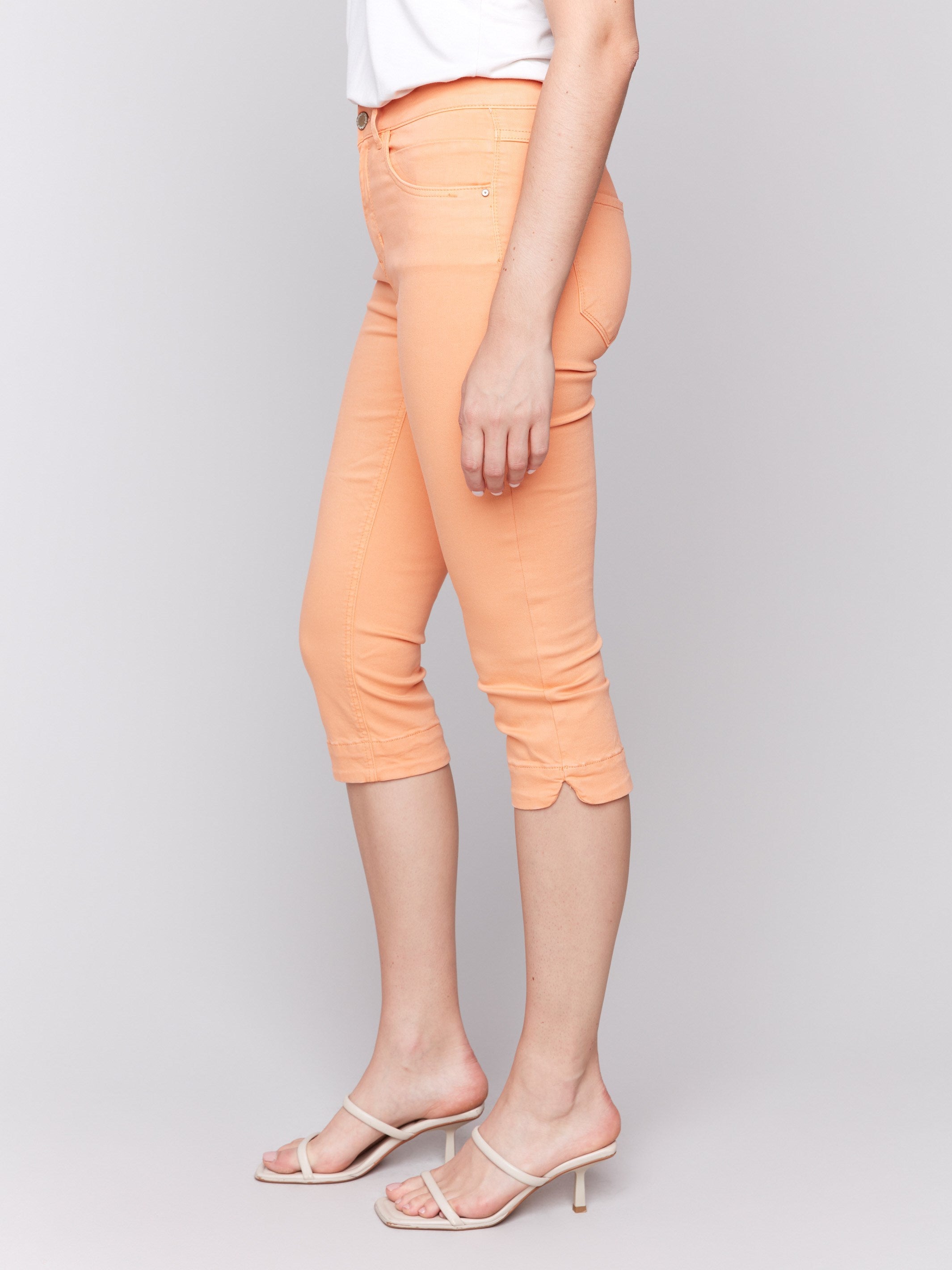 Slim leg fit enhances the silhouette of these papaya capris by Charlie B.