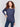 Dark blue knit sweater with a crew neckline, long ribbed sleeves, and back lace-up eyelet details by Charlie B.