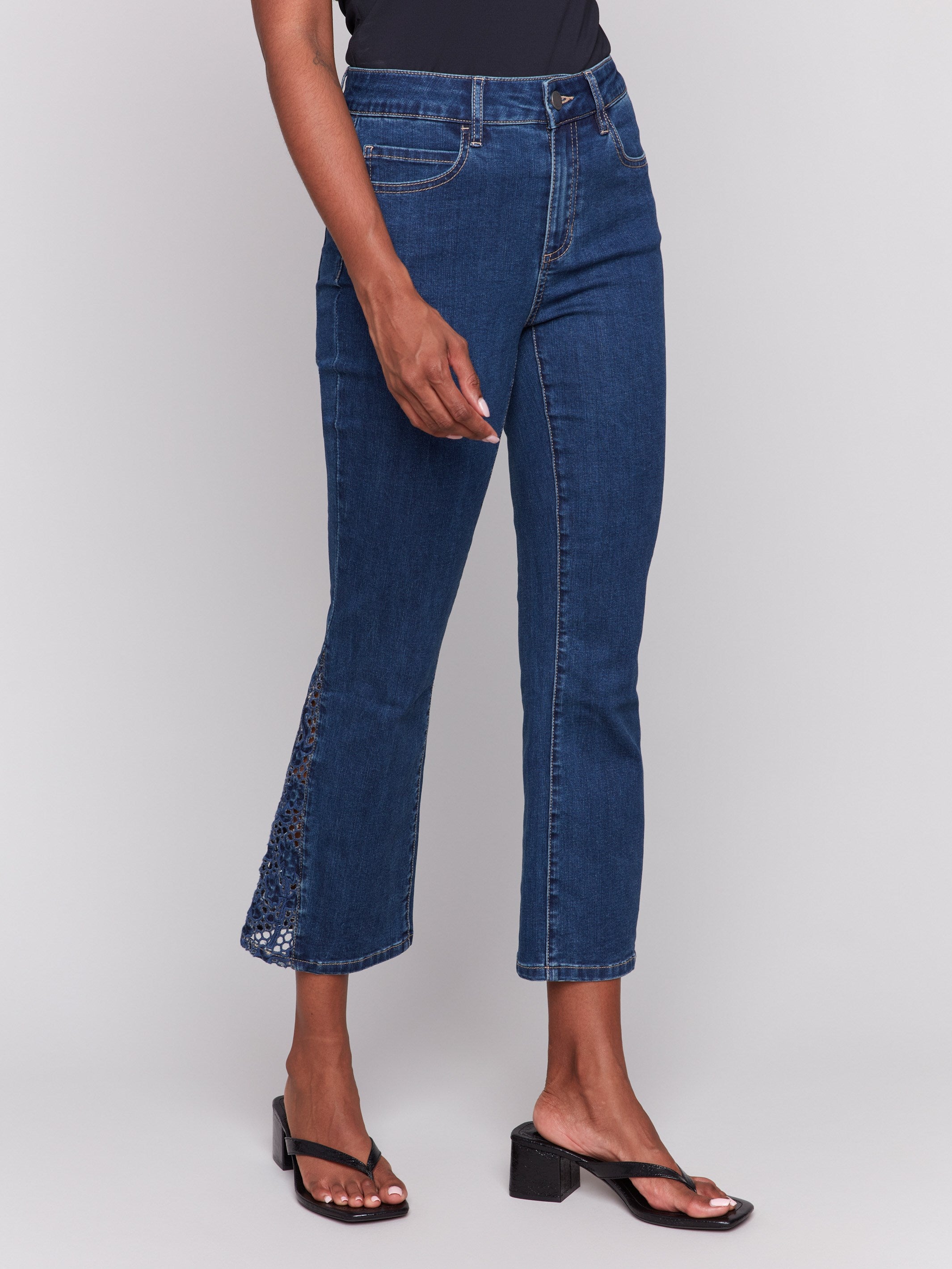 Five-pocket indigo jeans with unique lace cuts on the sides by Charlie B.