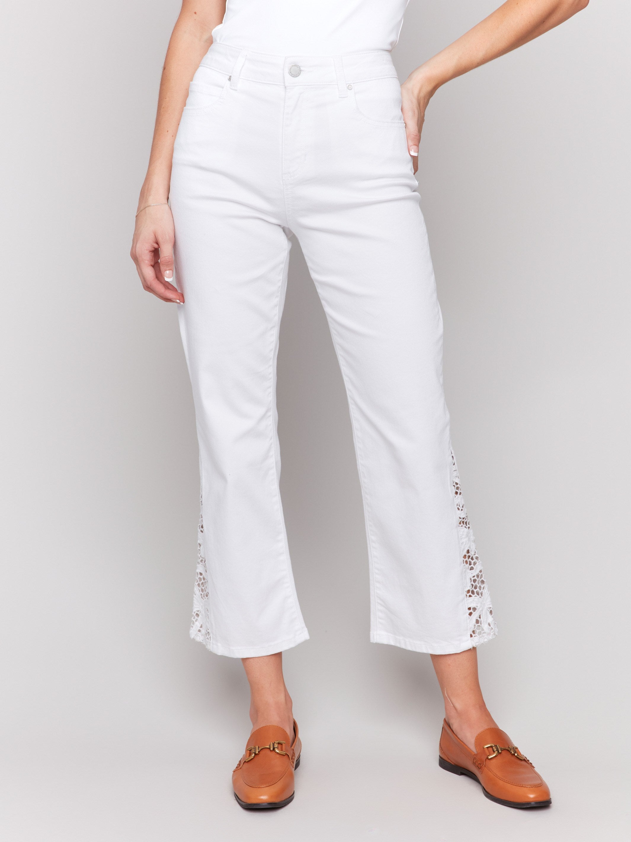 Regular rise bootcut pants in white with functional pockets by Charlie B.